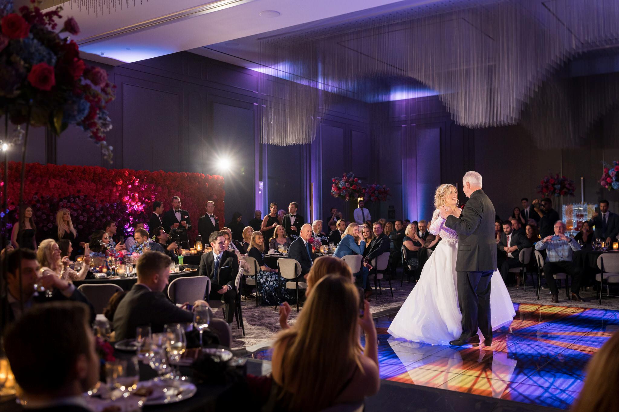 A dad and his daughter formally dance at her Daxton Hotel wedding.  