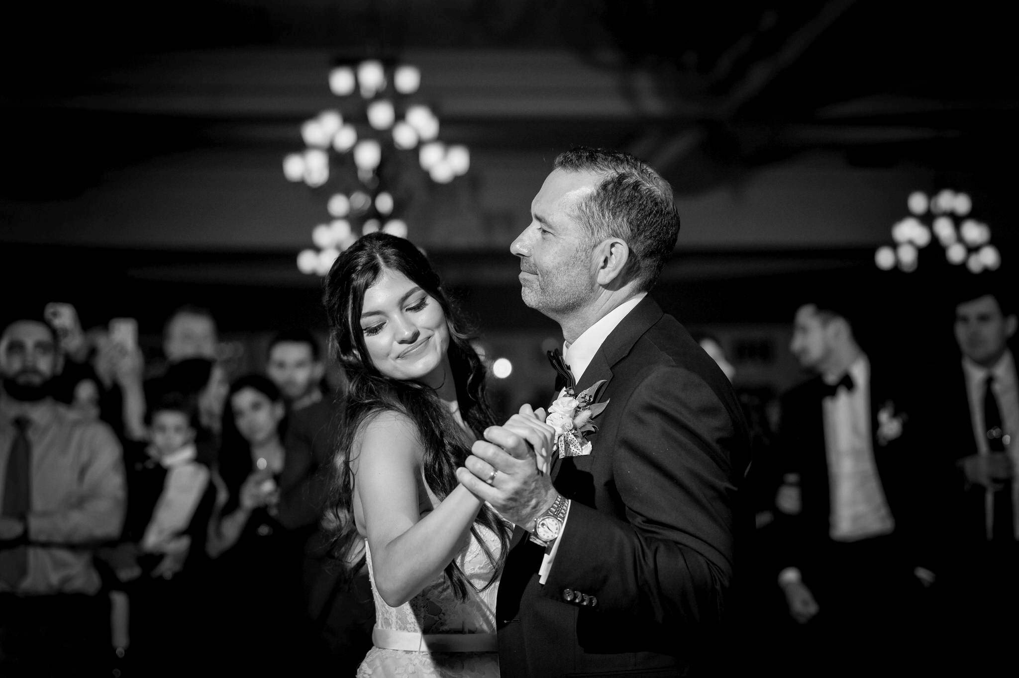 A bride dances with her dad at a wedding in Petoskey, MI.  
