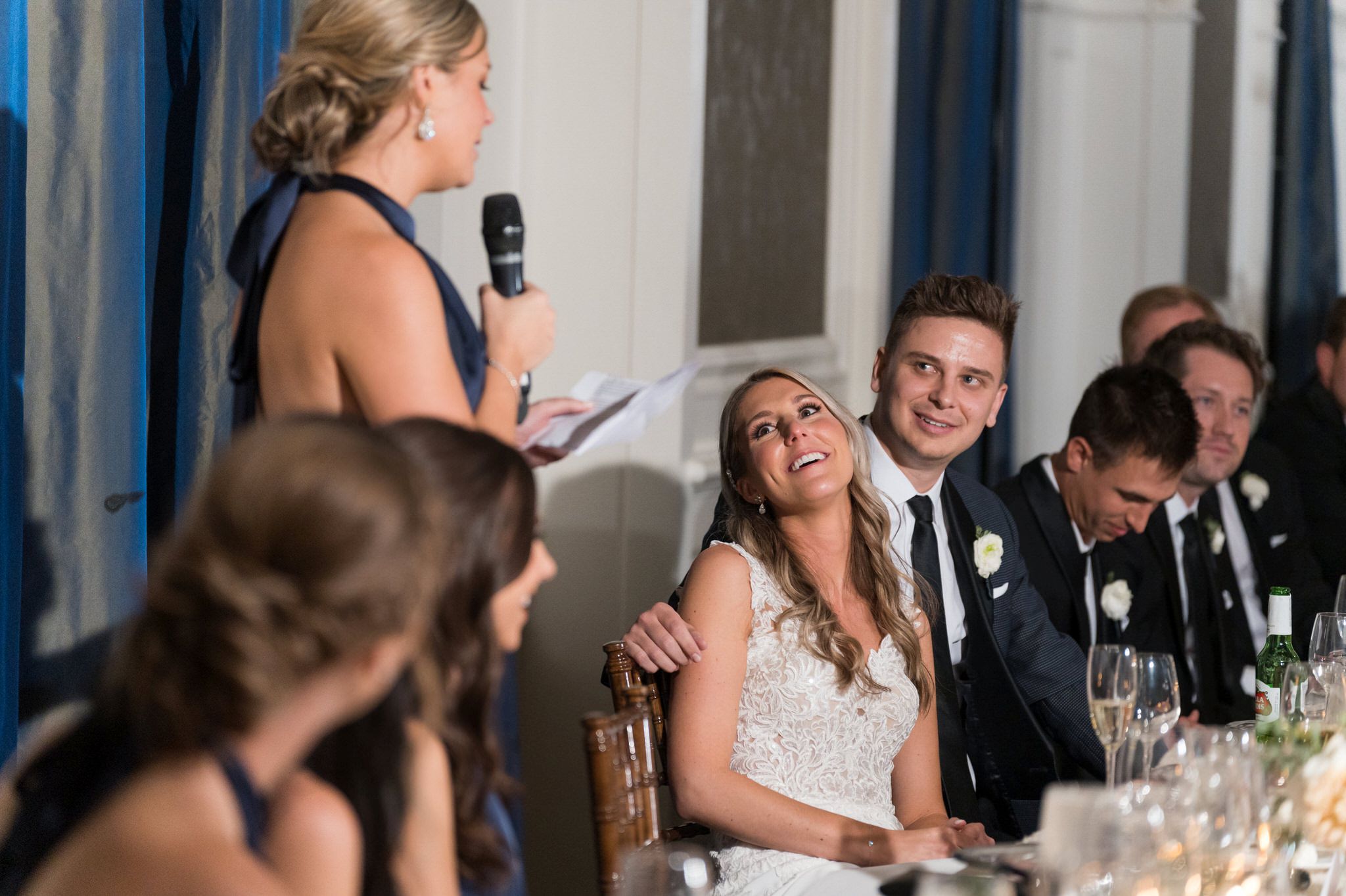 A bride reacts to a speech given by her sister at her Westin Book Cadillac wedding.  