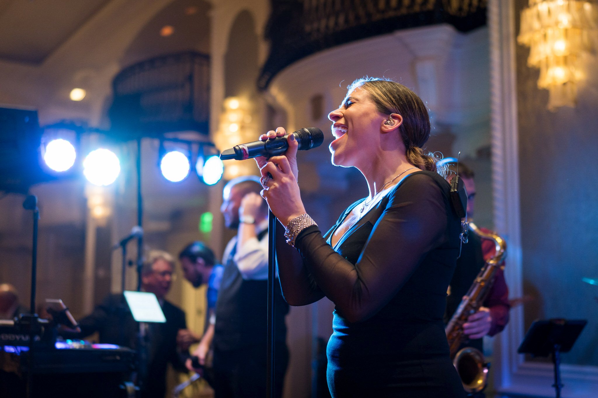 A female singer from E3 Detroit performs at a Westin Book Cadillac wedding.  