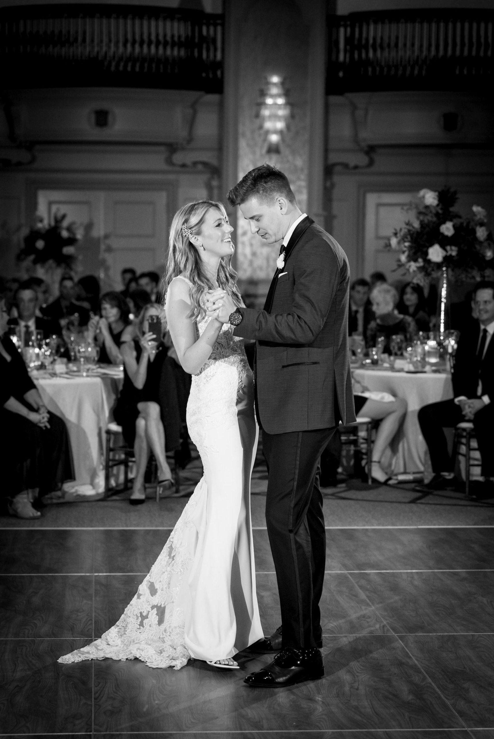 A bride and groom dance their first dance at their Westin Book Cadillac wedding reception.