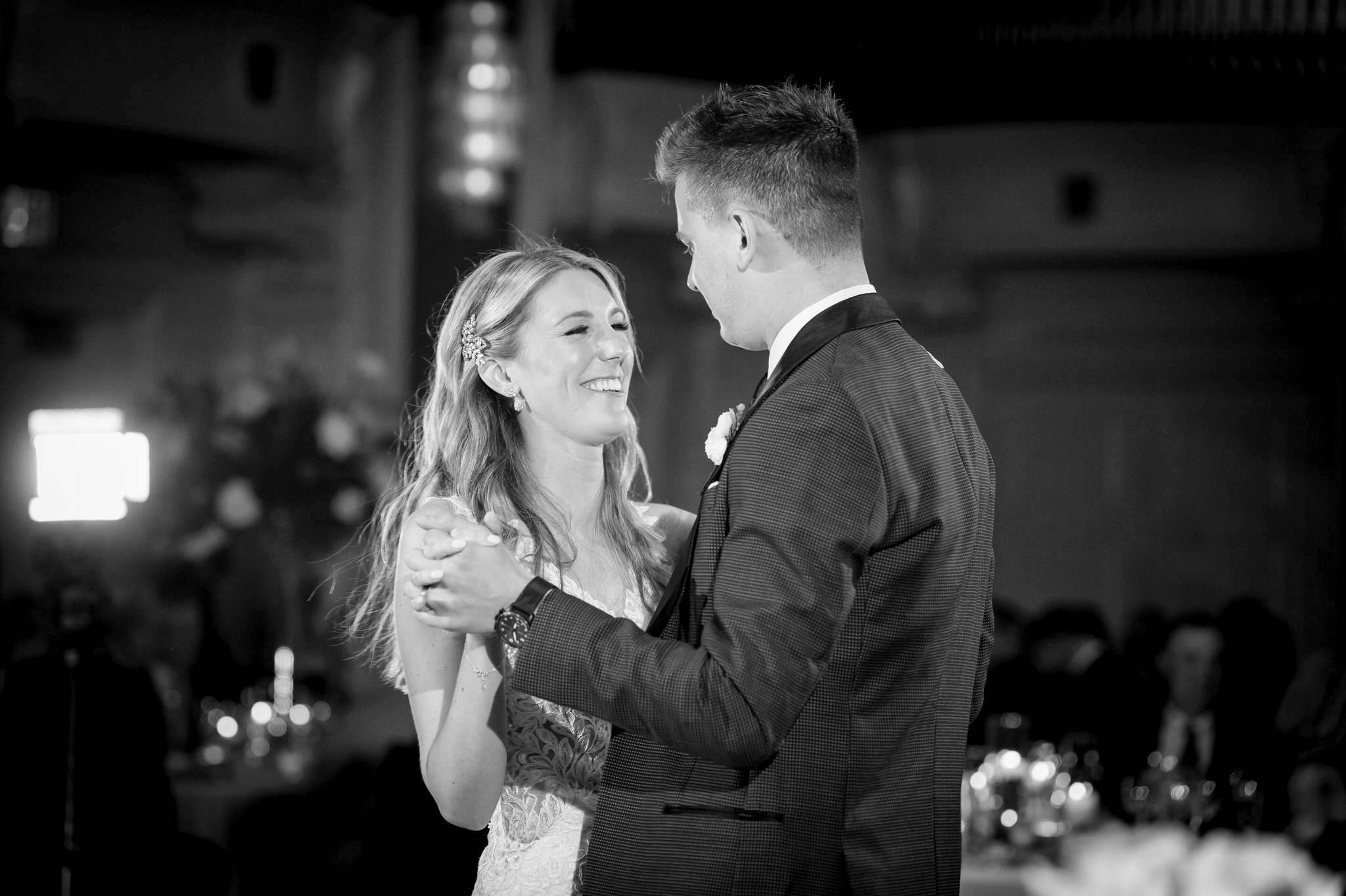 A bride and groom dance their first dance at their Westin Book Cadillac wedding reception.