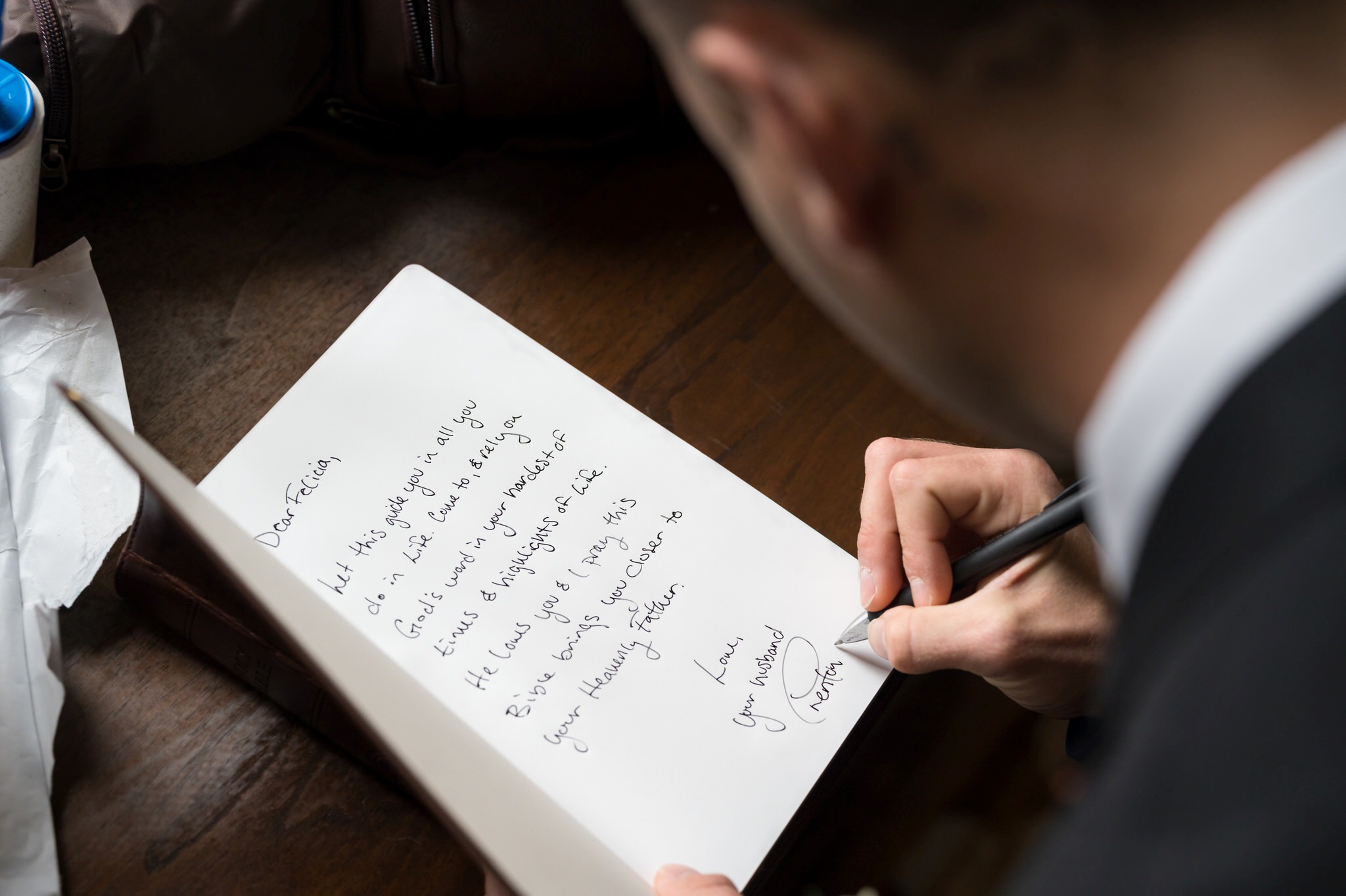 A groom leaves a note in a Bible for his wife to read as a wedding day gift.  