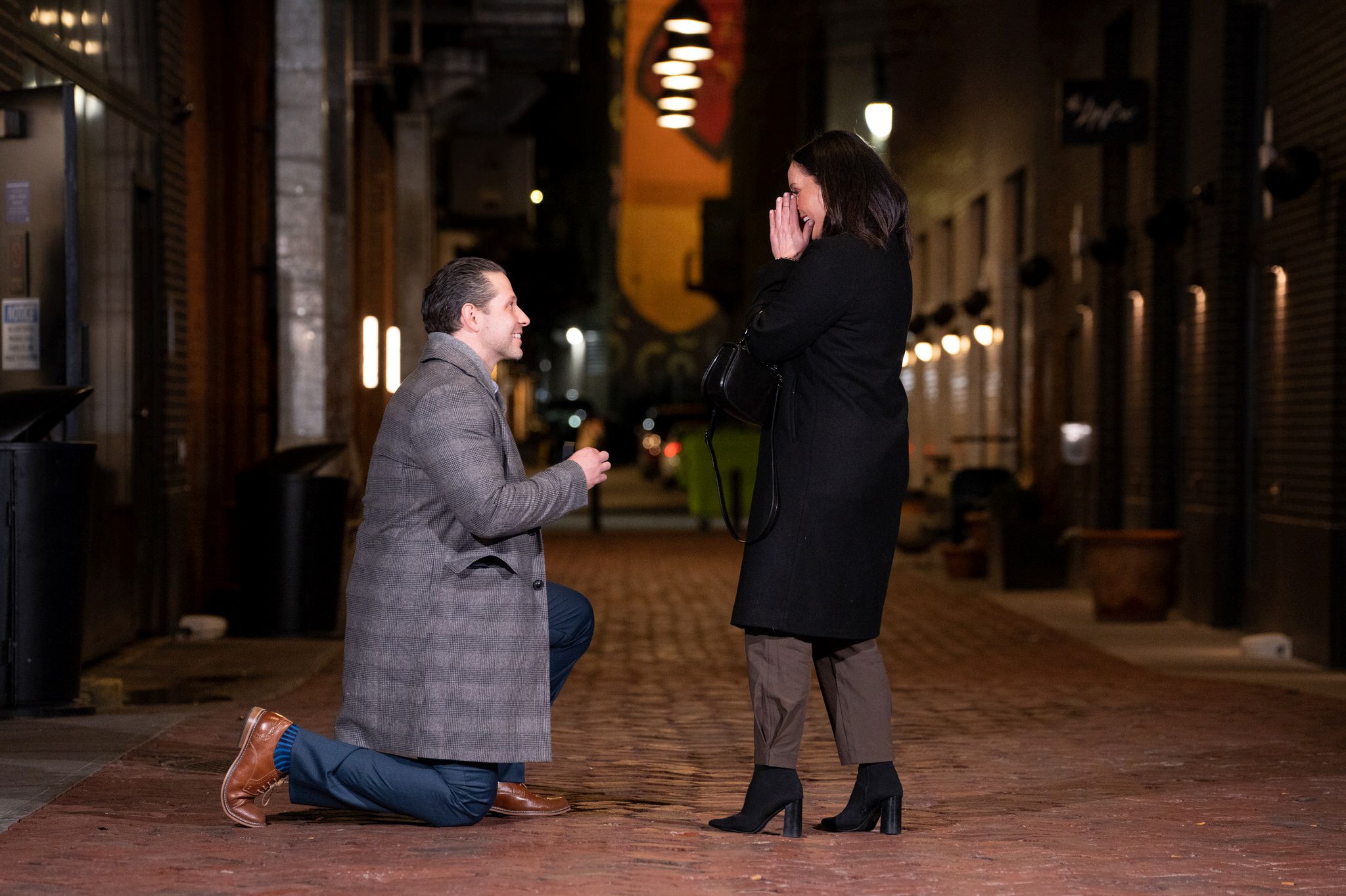 A woman reacts during a proposal in Parker's Alley in Detroit.  