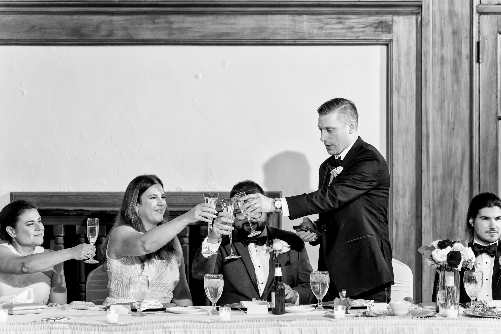 Toasts during speeches at a Detroit Yacht Club wedding. 