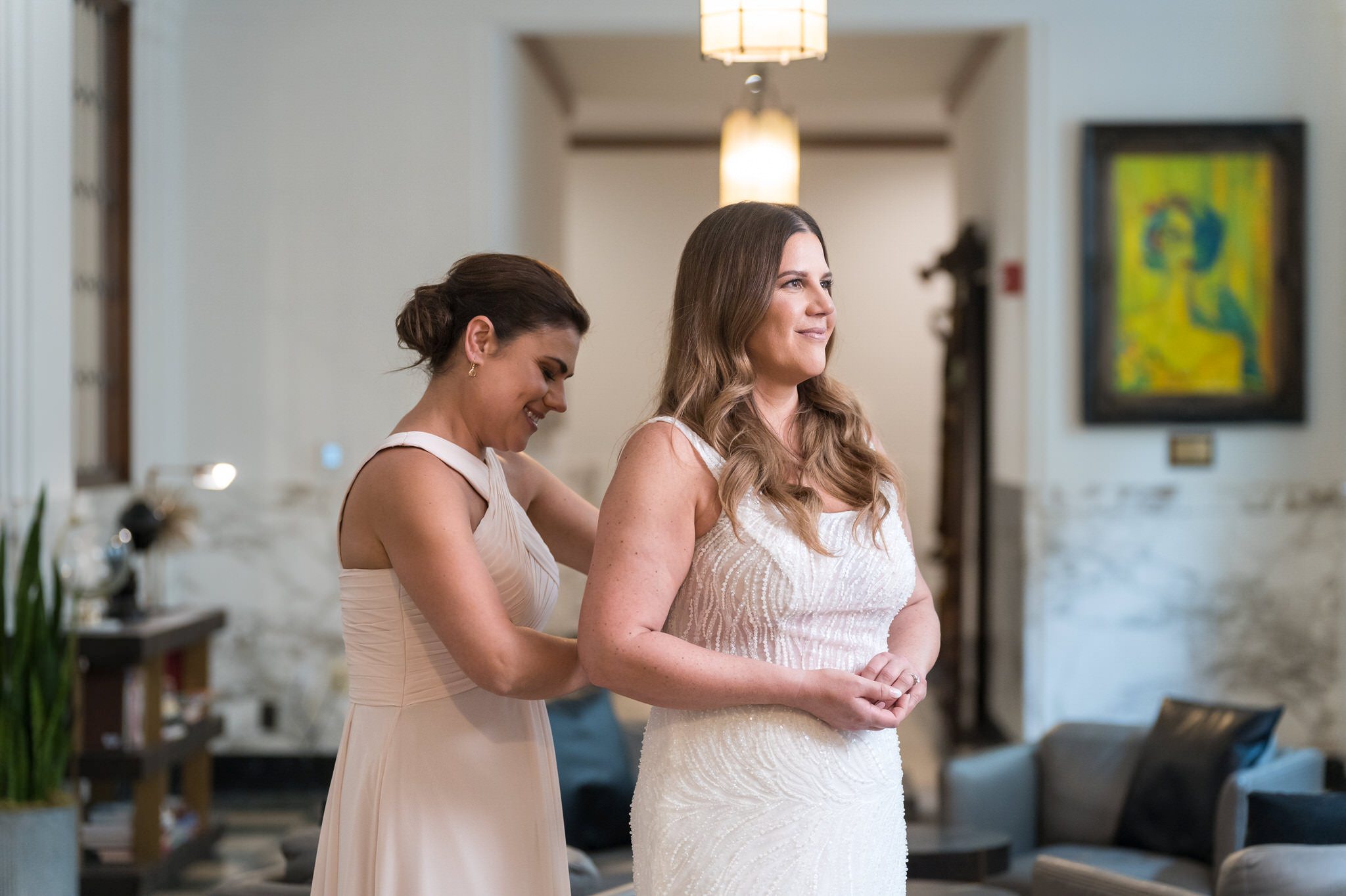A bride gets ready in the lobby of the Foundation Hotel.