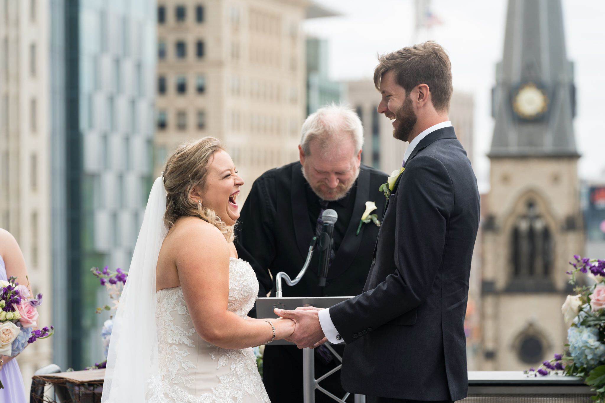Bride and groom share rings and vows at their Madison Building wedding.