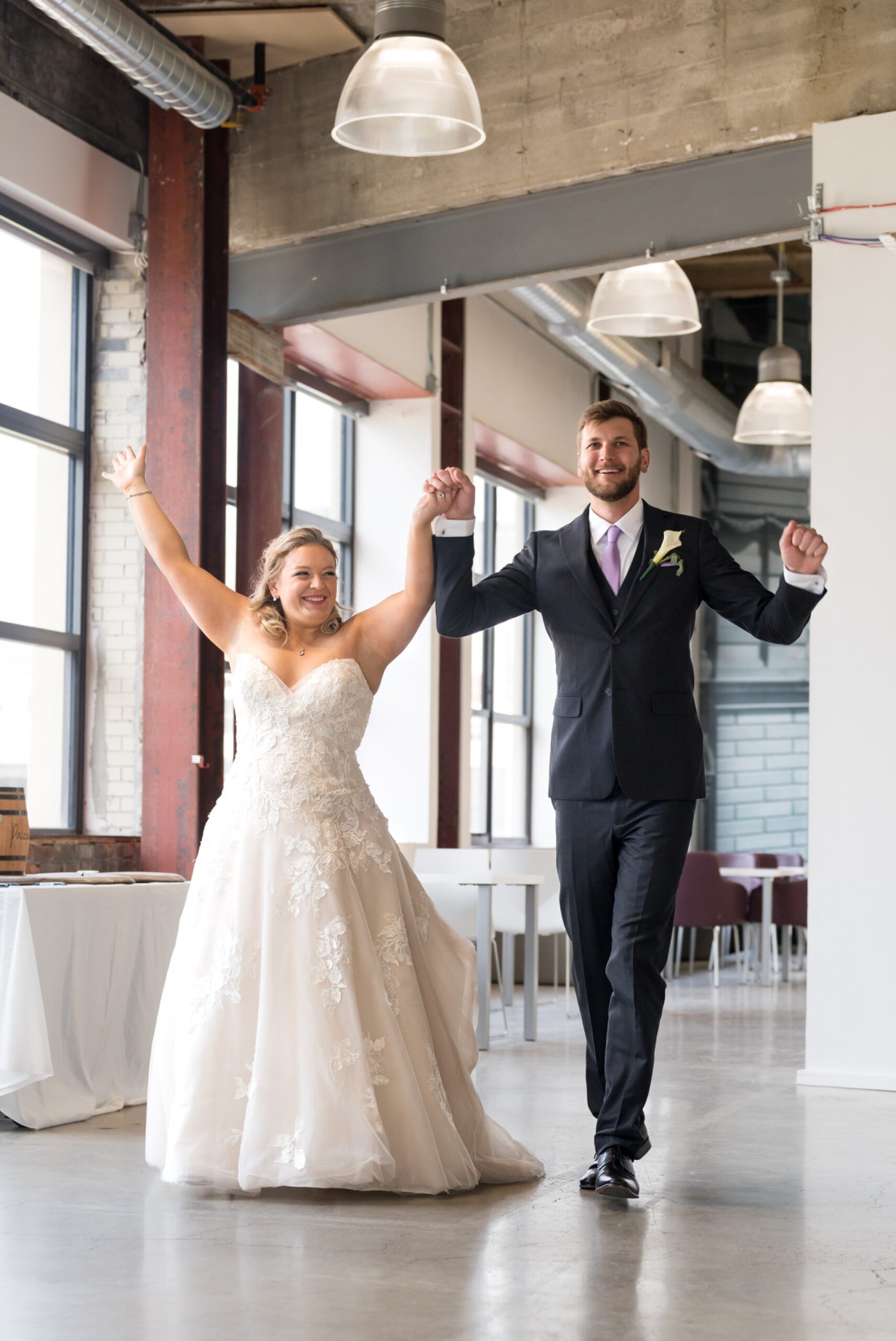 Bride and groom are announced and enter their reception space at a Madison Building wedding.  