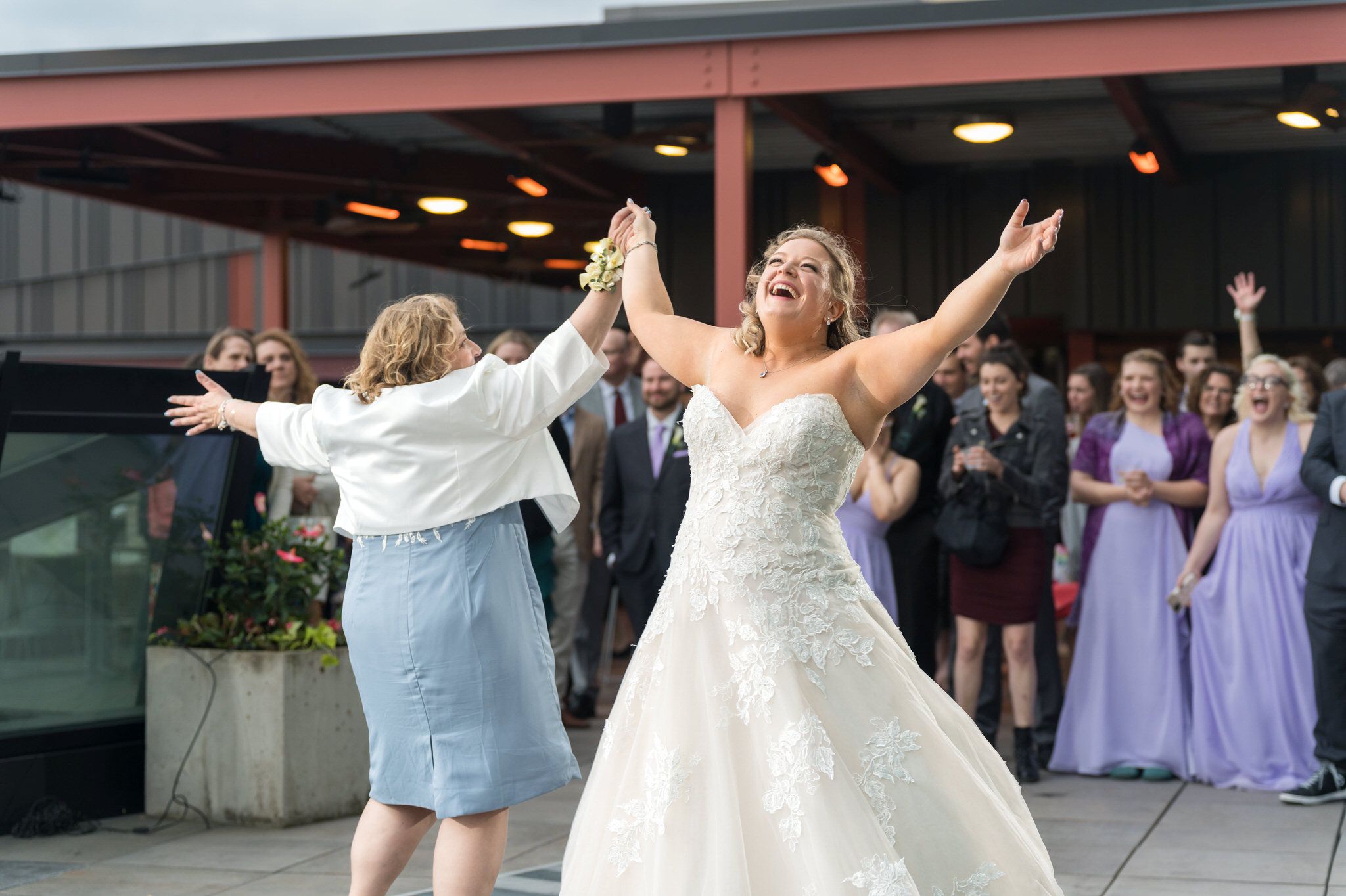 The bride and her mom share an emotional first dance at a Madison Building wedding in Detroit. 