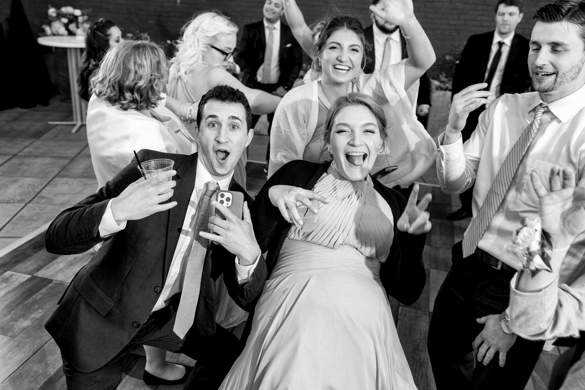 Guests dance on rooftop at a Madison Building wedding. 