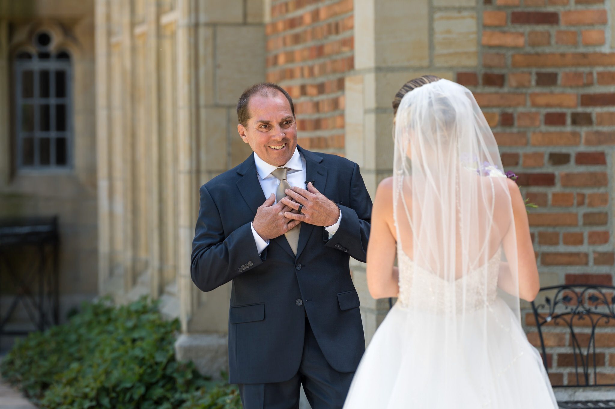 Dad reacts to seeing his daughter bride at her wedding at Meadowbrook Hall.