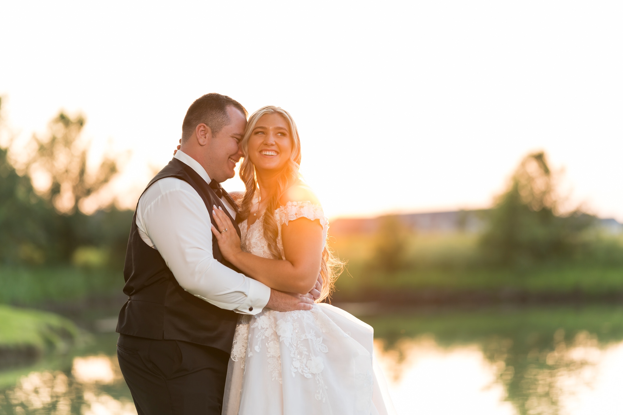 The bride and groom steal a moment during golden hour at a wedding reception at the Italian American Cultural Society. 