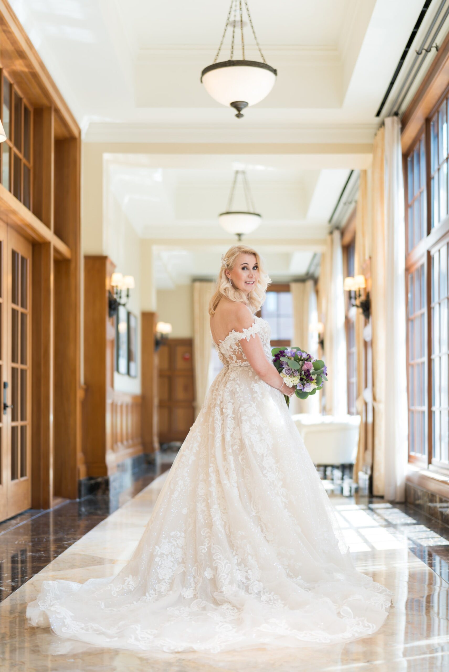 A bride poses in the hallway before her Royal Park wedding.  
