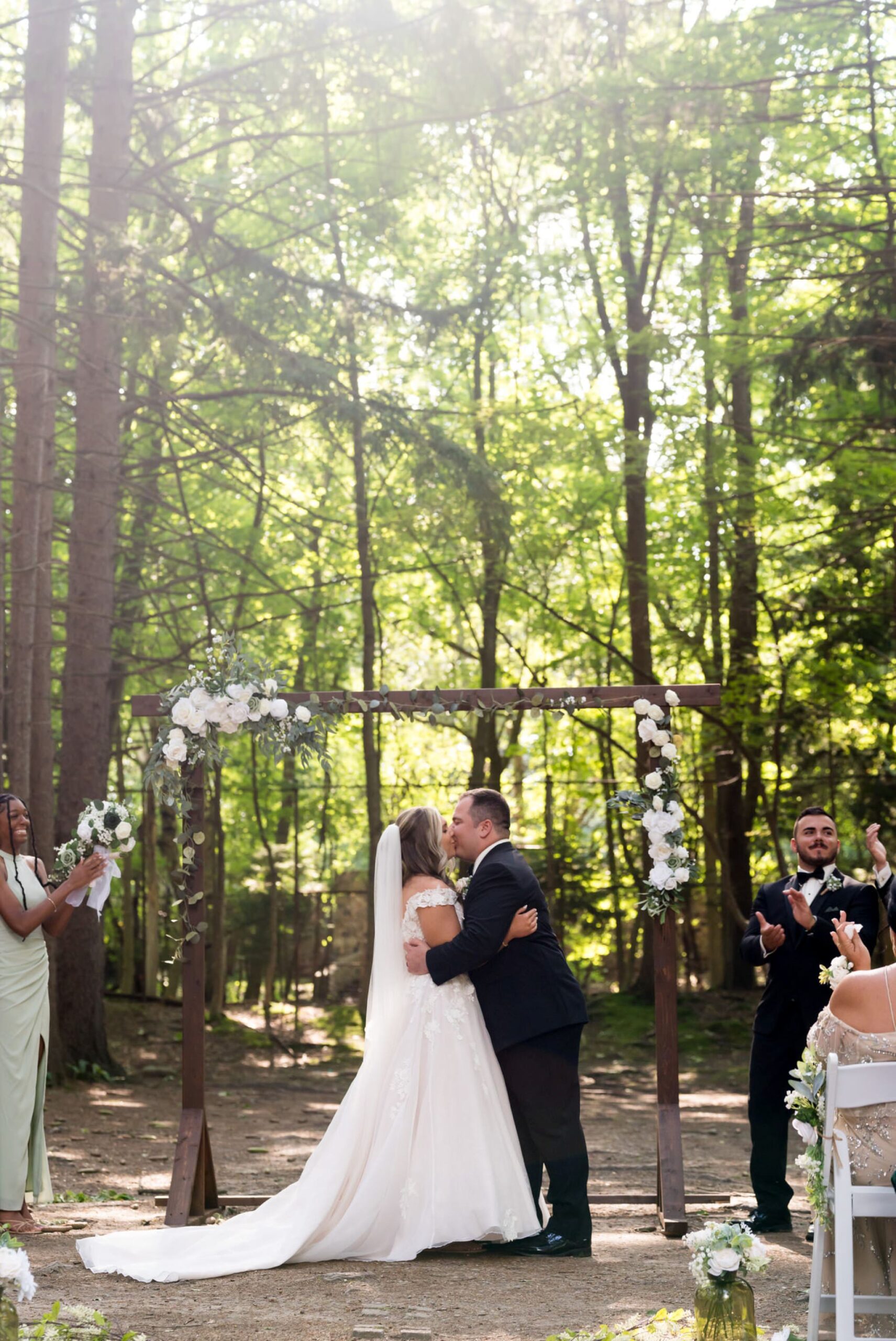 The bride and groom kiss at their Stony Creek wedding in The Pines.  