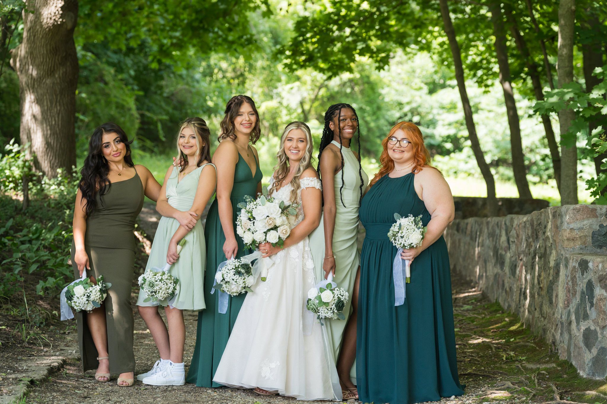 Bridesmaids pose for a photo at a Stony Creek wedding in Shelby Township, MI