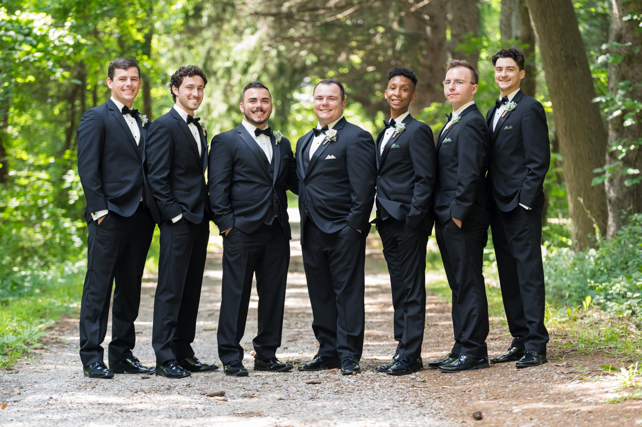 Groomsmen pose for a photo at a Stony Creek wedding in Shelby Township, MI