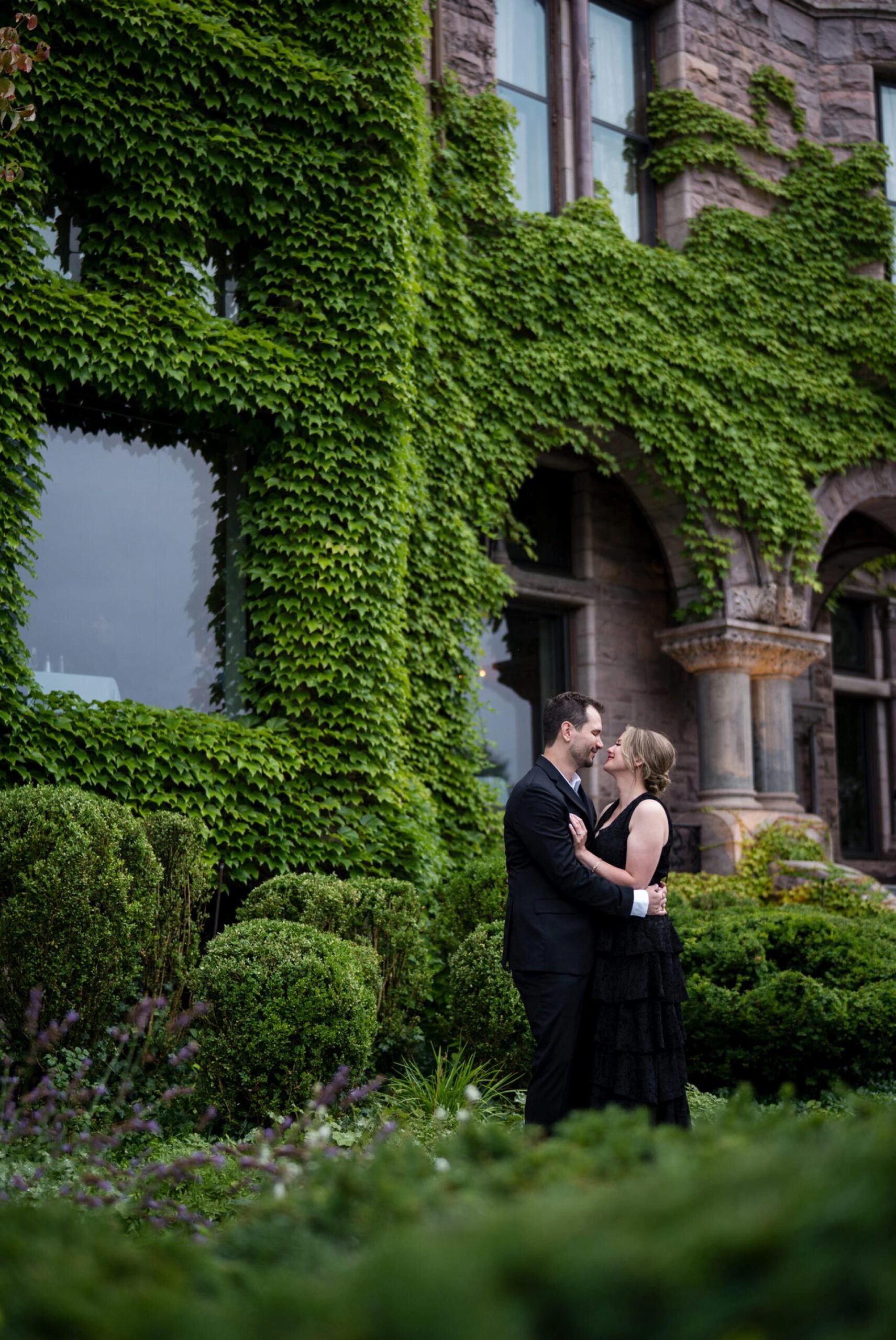 A couple embrace in a garden following a Whitney proposal in Detroit. 