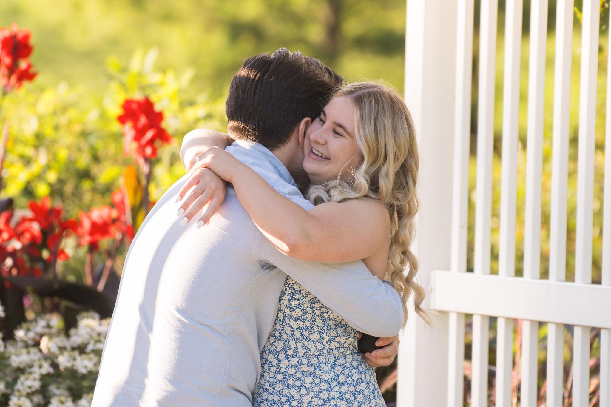 A guy hugs his fiance after a successful Quarton Lake proposal. 