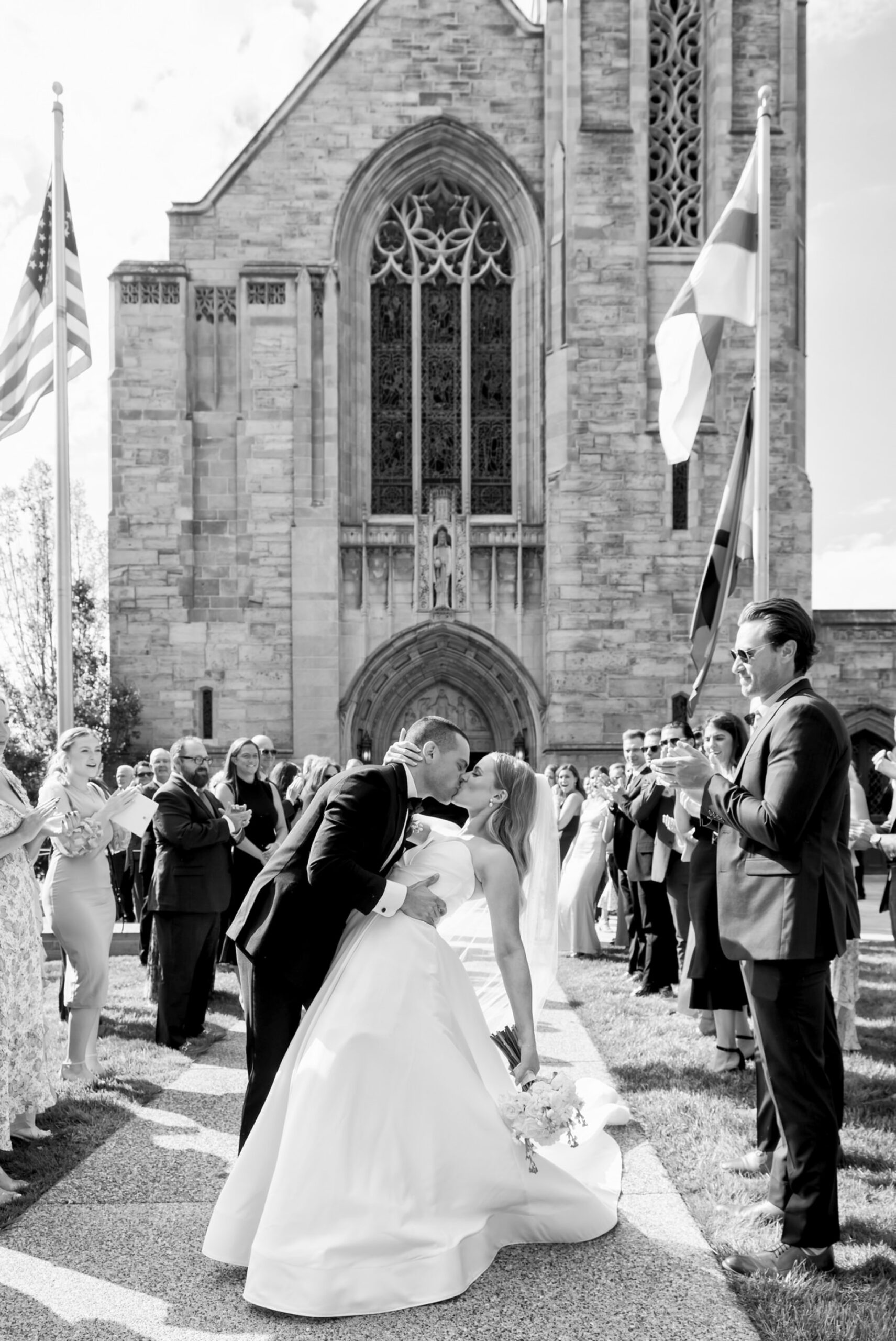 The bride and groom celebrate during their grand exit from their wedding at Christ Church Grosse Pointe. 