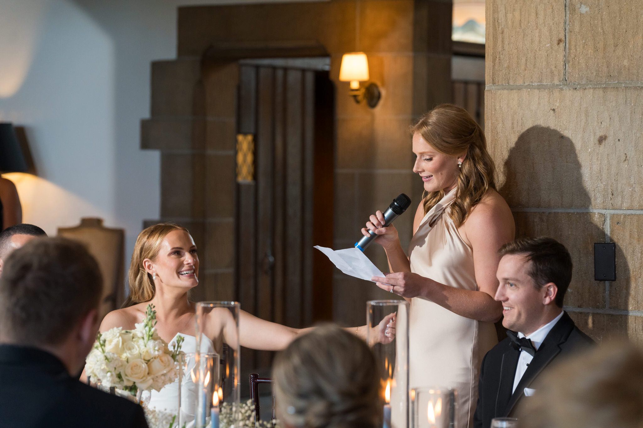 The maid of honor gives a touching toast to her twin sister during a Country Club of Detroit wedding reception.