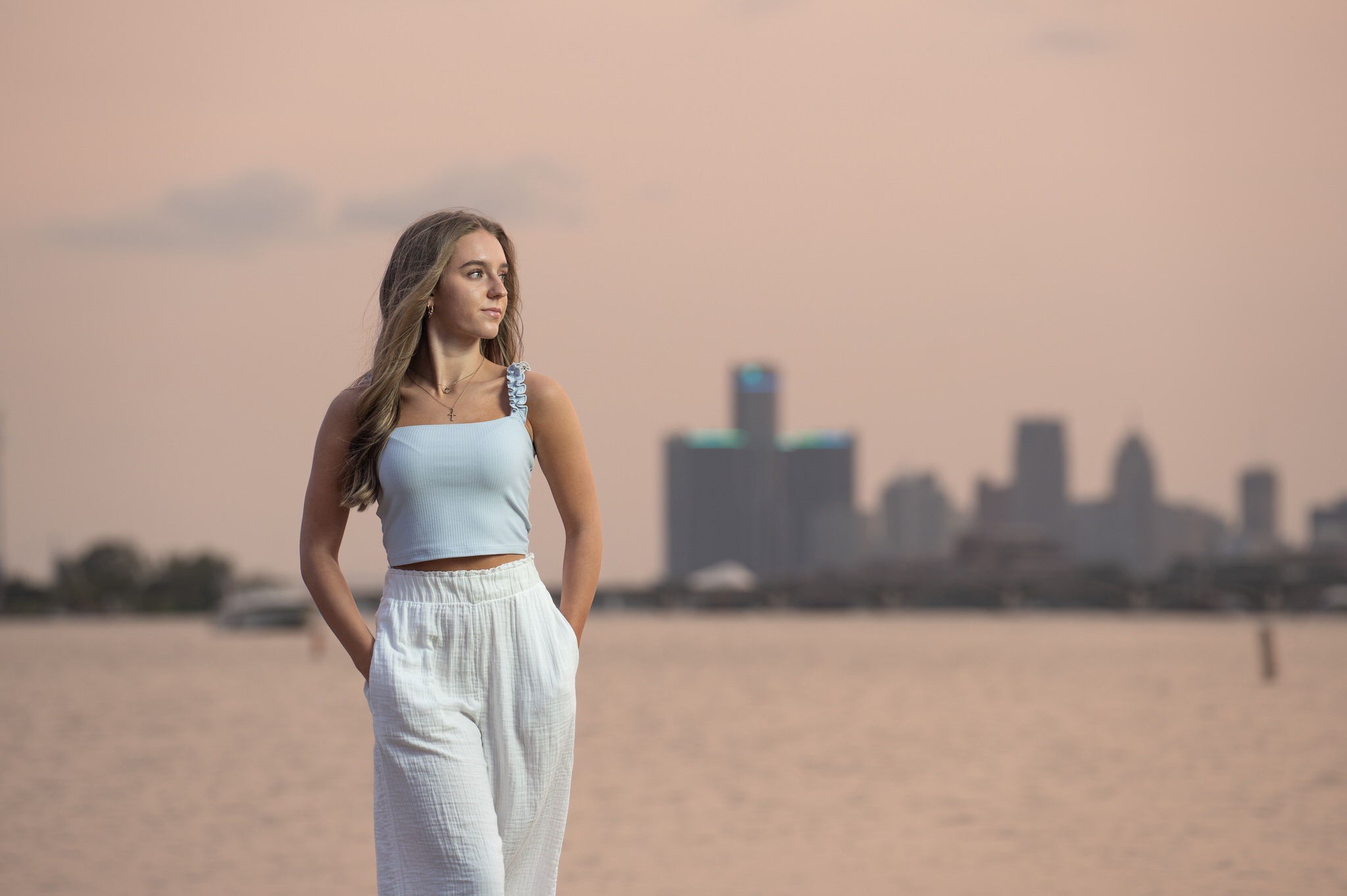 Senior photos taken at sunset on Belle Isle with the Detroit skyline in the background. 