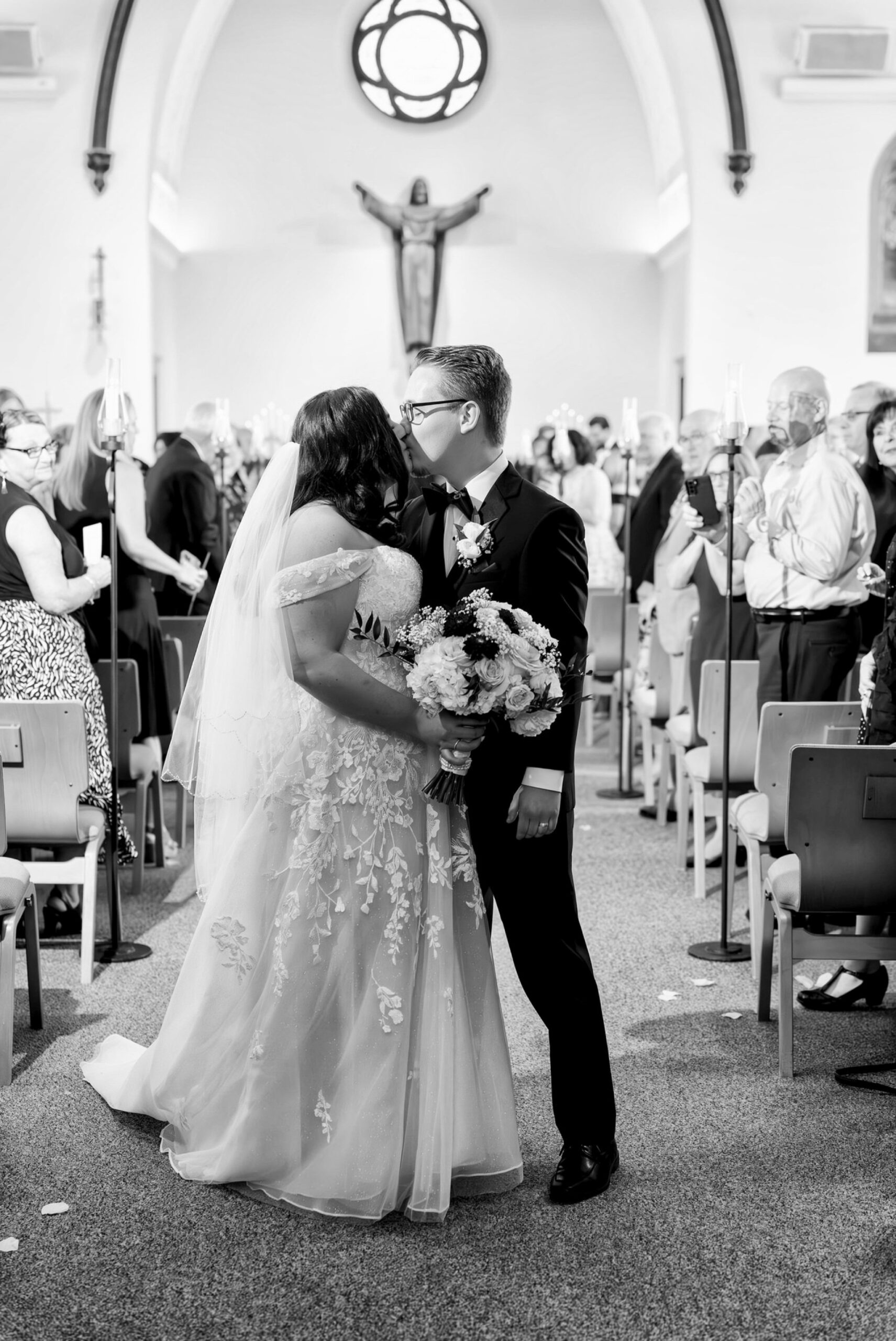 The bride and groom walk down the aisle on their wedding day at Immanuel Lutheran Church in Macomb, MI. 