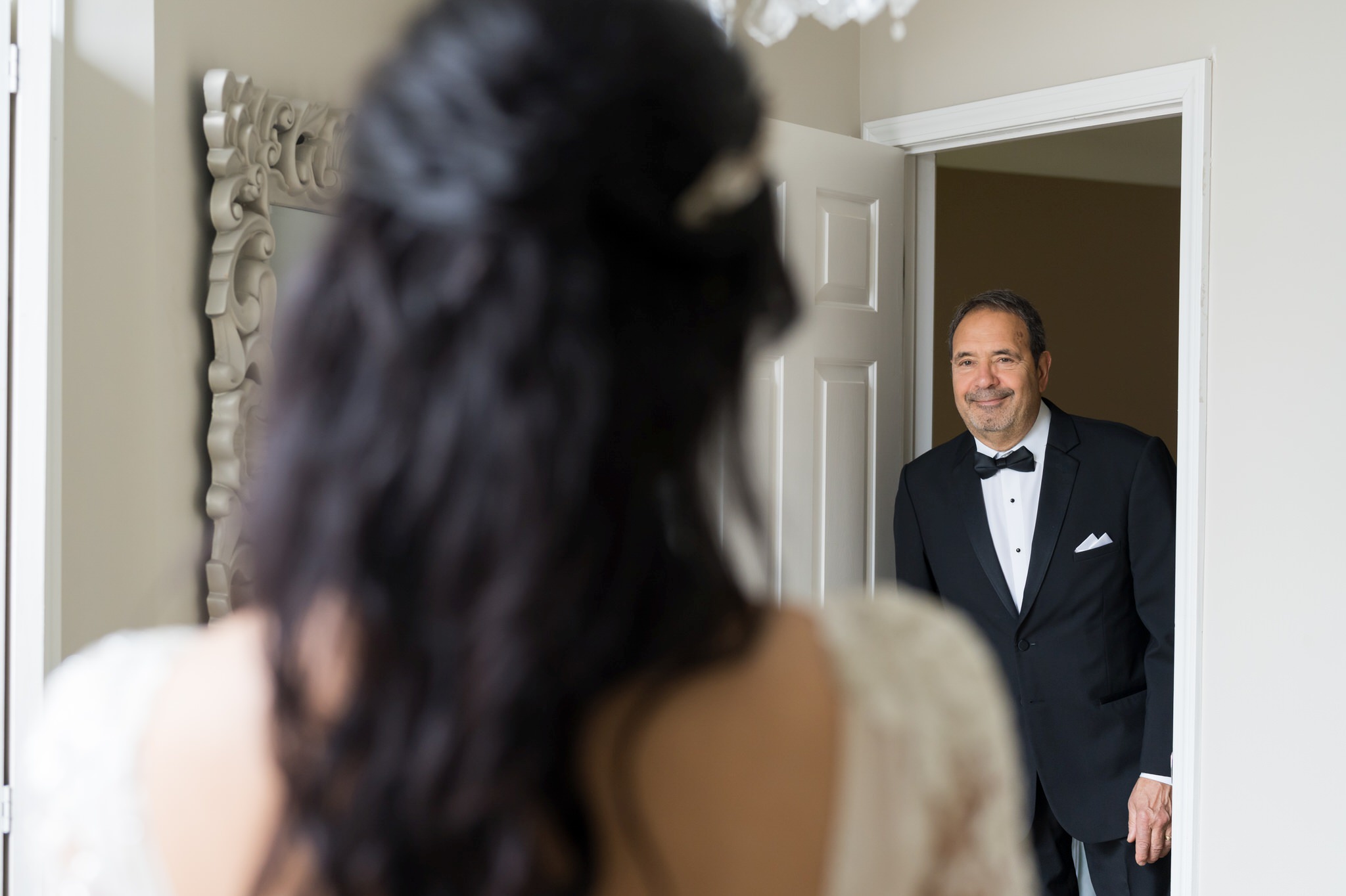 A dad and his daughter share a first look on her wedding day. 