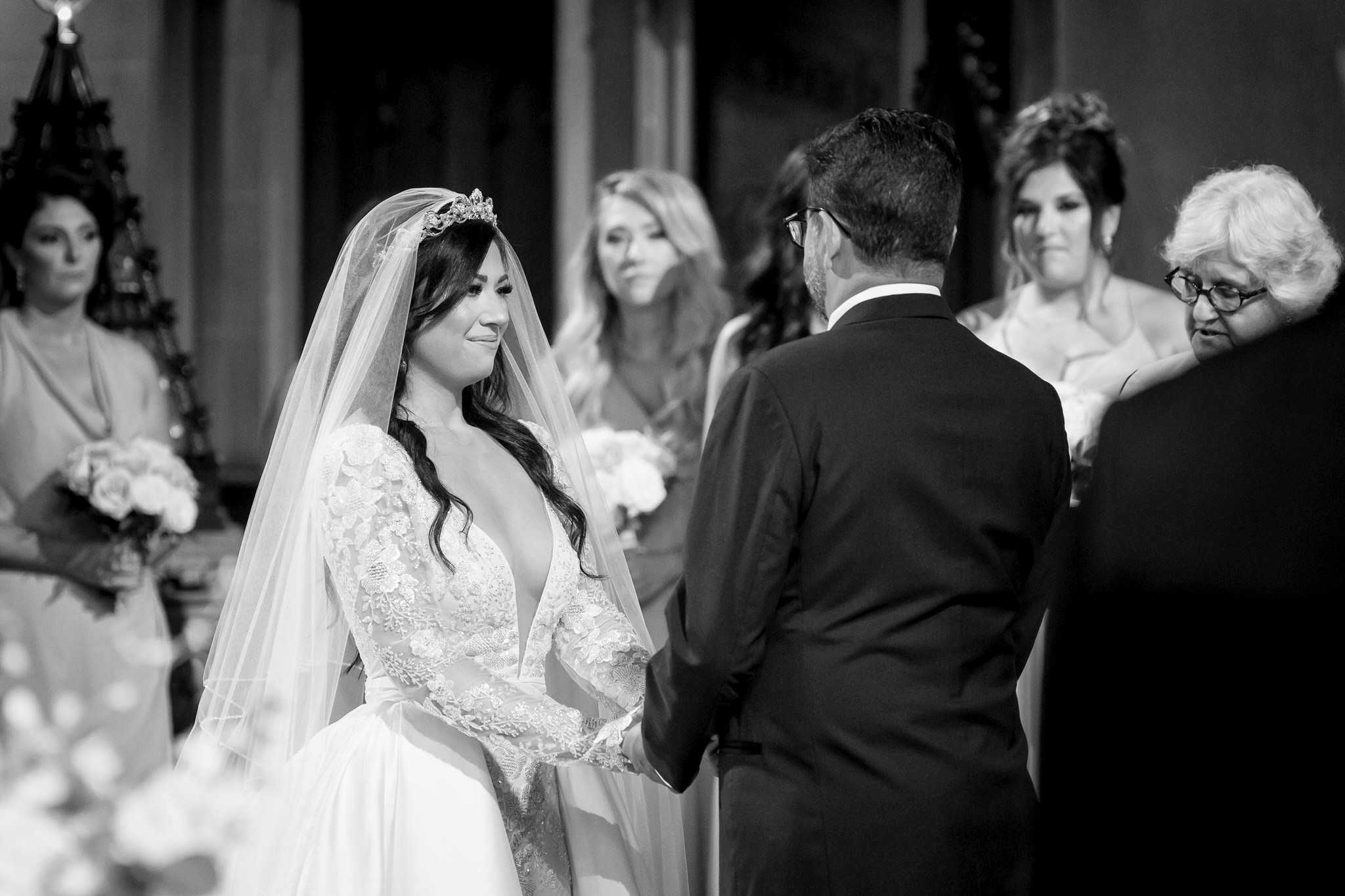 A bride and groom exchange rings at the altar at their Fort Street Presbyterian Church Detroit wedding.