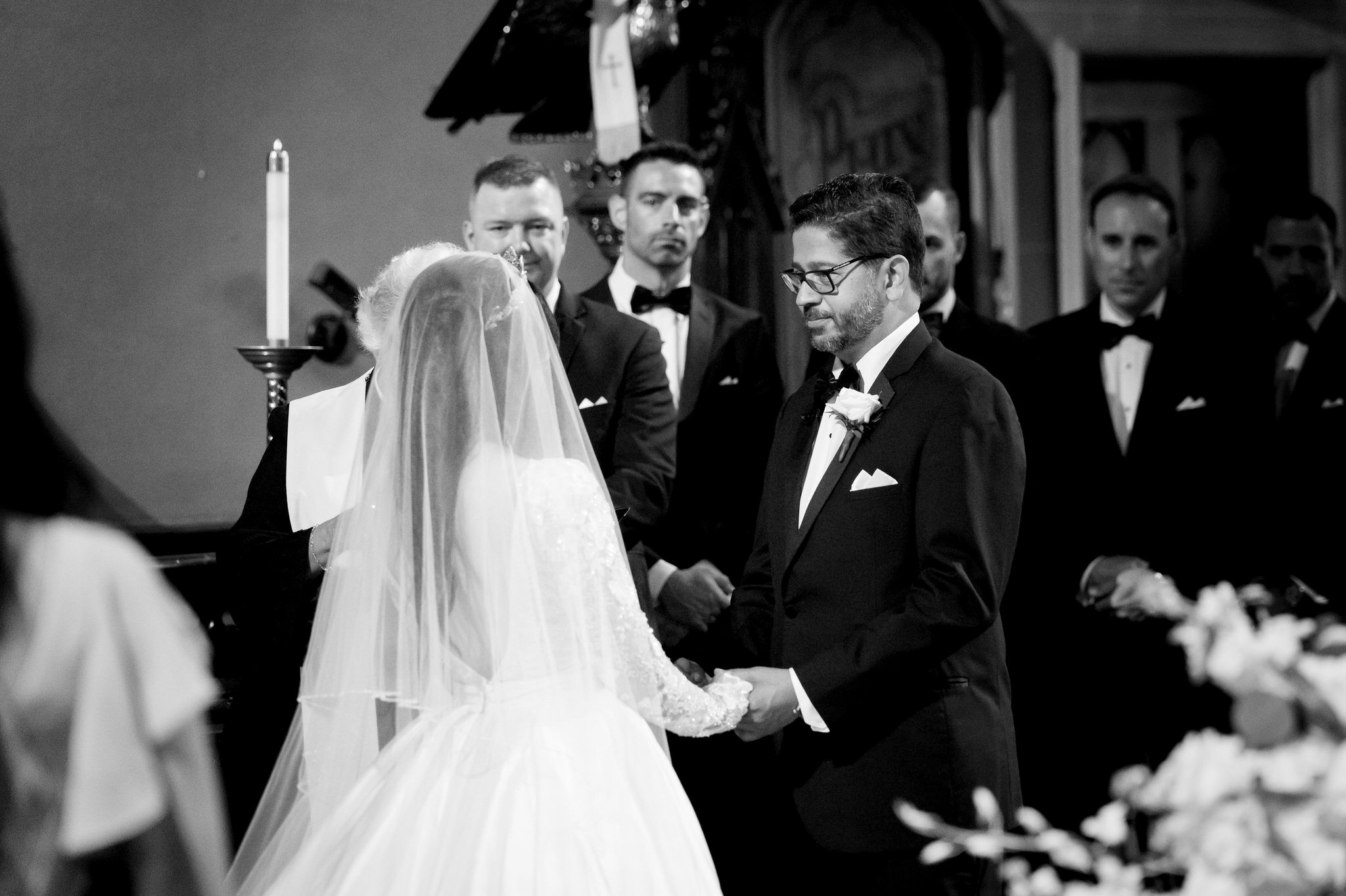 A bride and groom exchange vows at the altar at their Fort Street Presbyterian Church Detroit wedding.