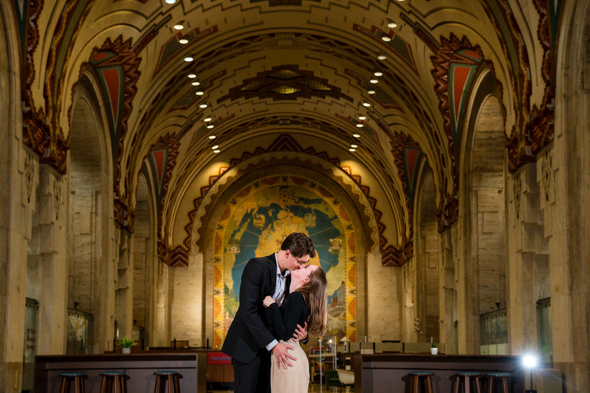 A couple celebrates their Guardian Building proposal with a kiss.  