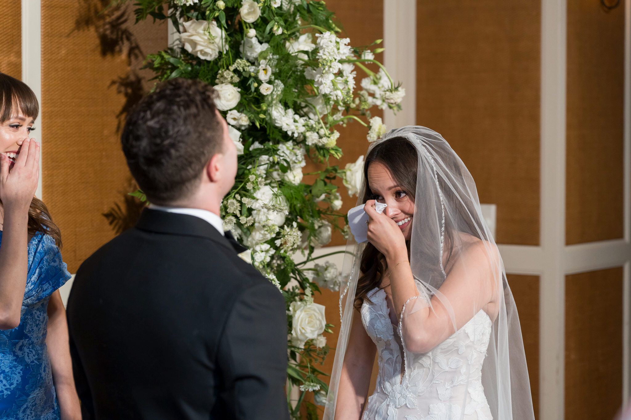 A bride wipes away tears during her San Morello wedding.  