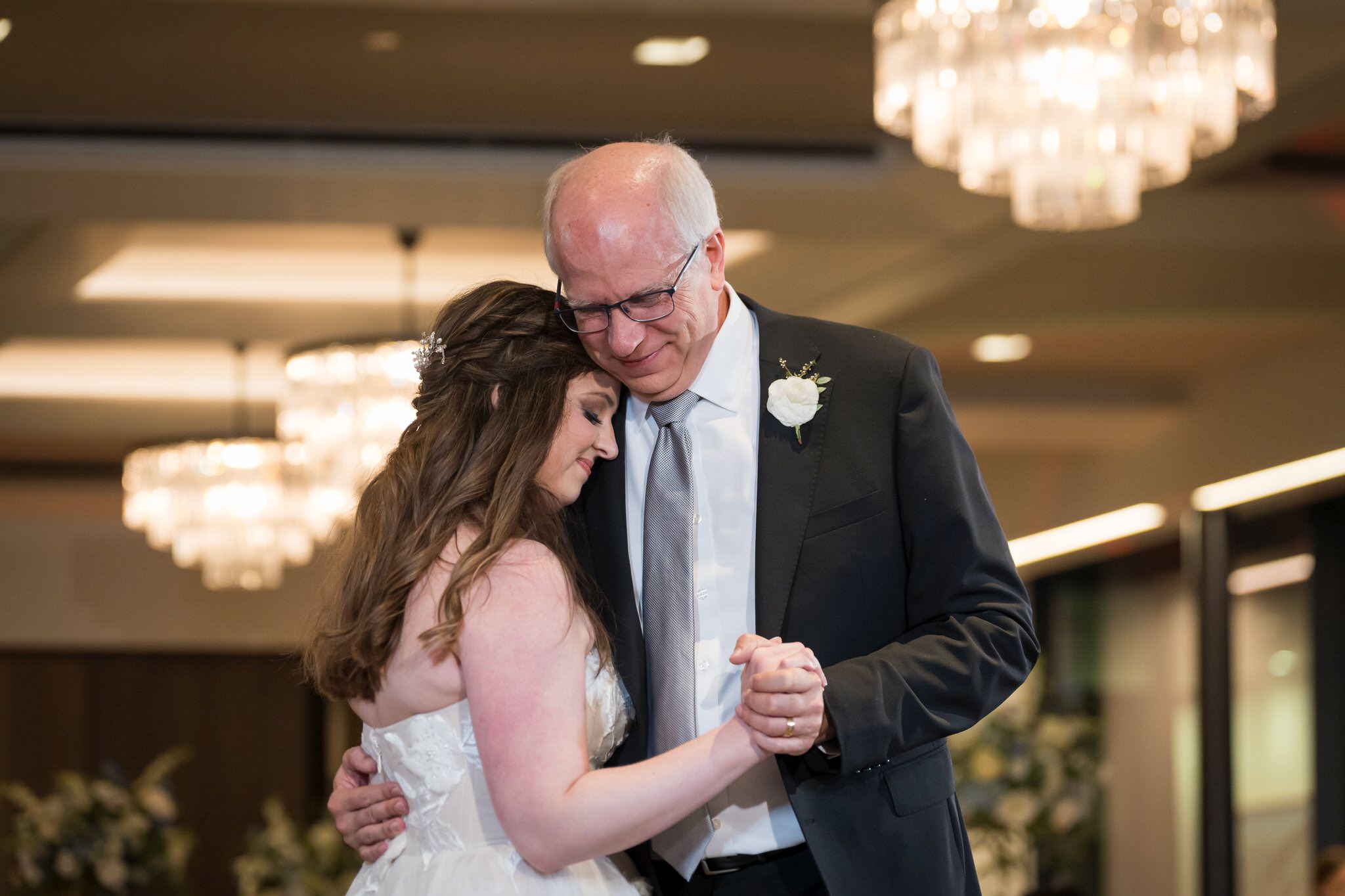 The father and daughter share a dance at her wedding at the War Memorial. 