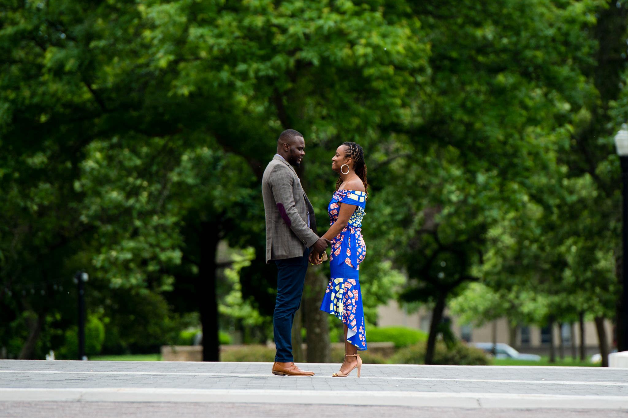 A couple stand outside of the DIA prior to a marriage proposal. 