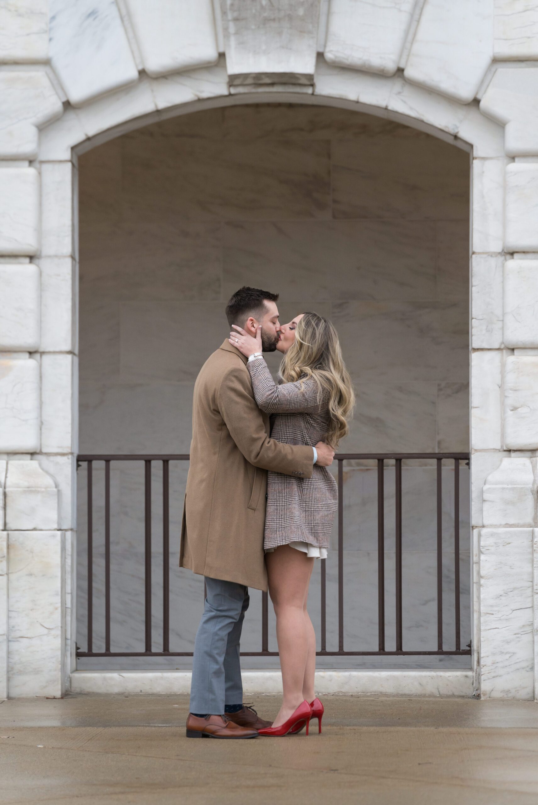 A couple kisses after their Detroit Institute of Arts proposal.