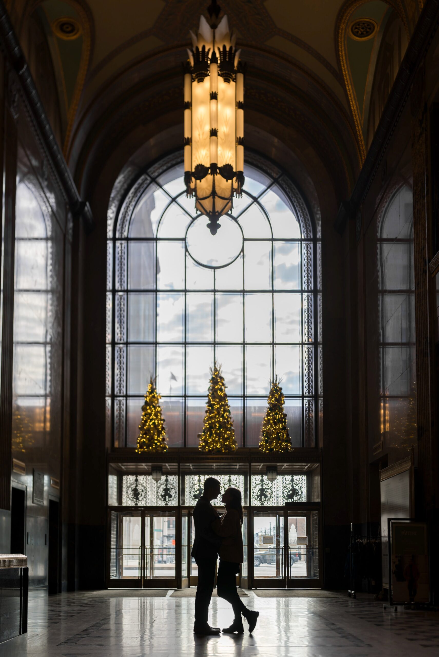 A silhouette of a couple during their Fisher Building proposal.  