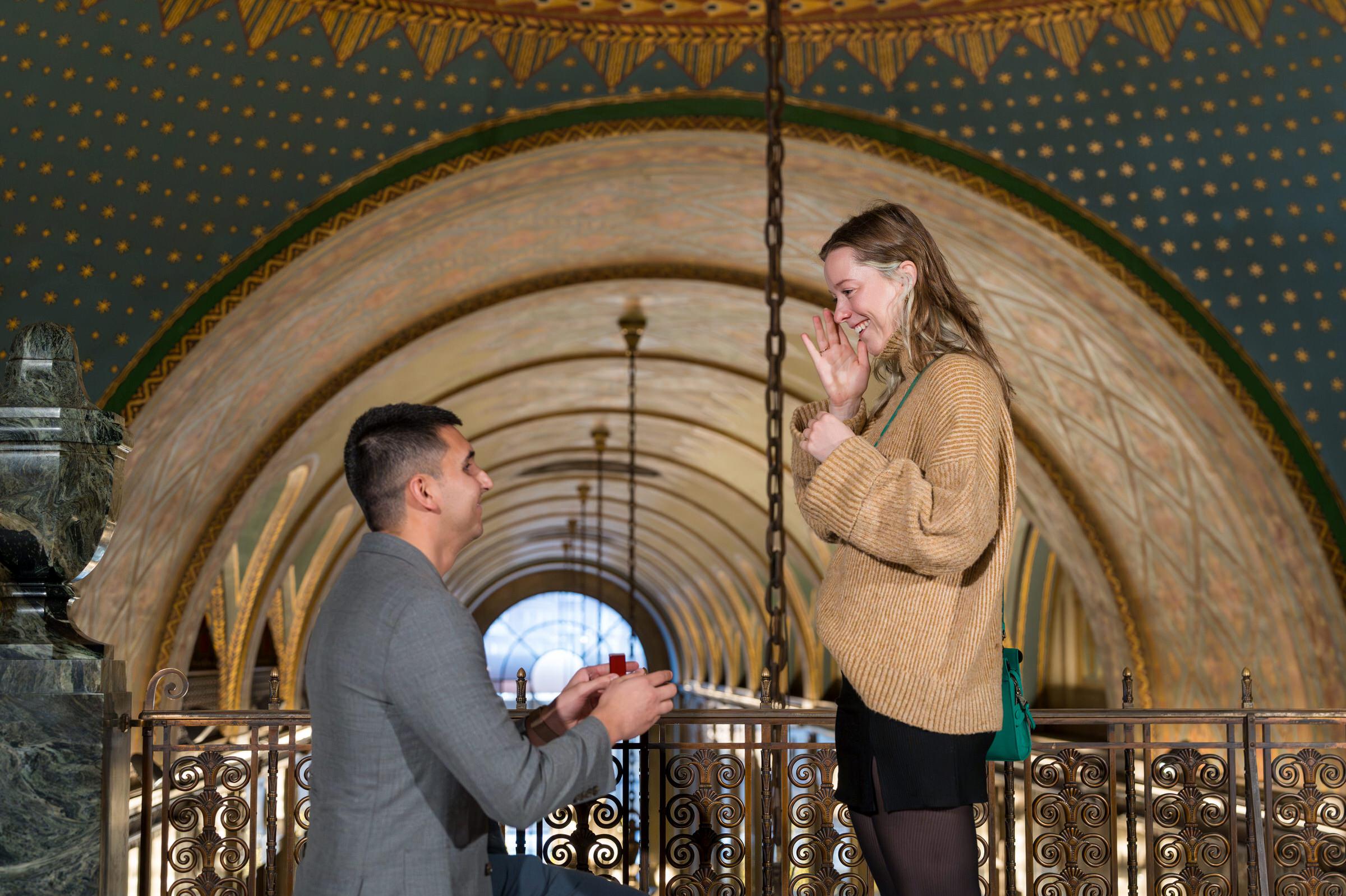 A fiancee reacts during her Fisher Building proposal in Detroit. 