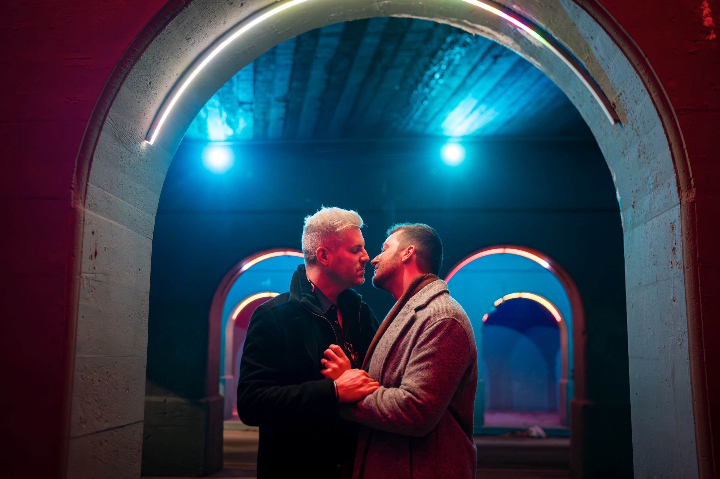 A LGBTQ+ engagement session under colored archways in Detroit.  