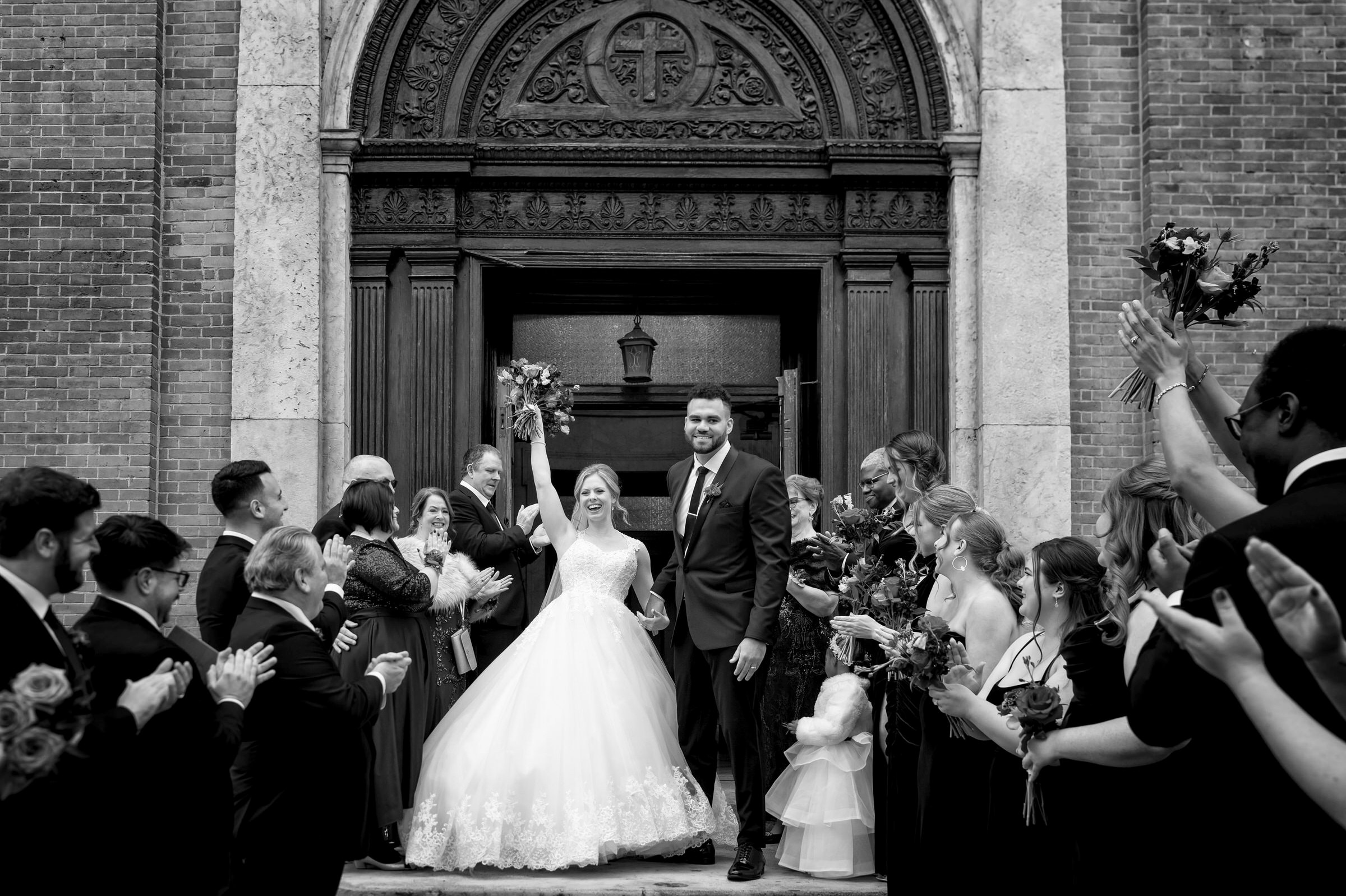 A wedding day grand exit at Saints Peter and Paul Jesuit Church in Detroit.