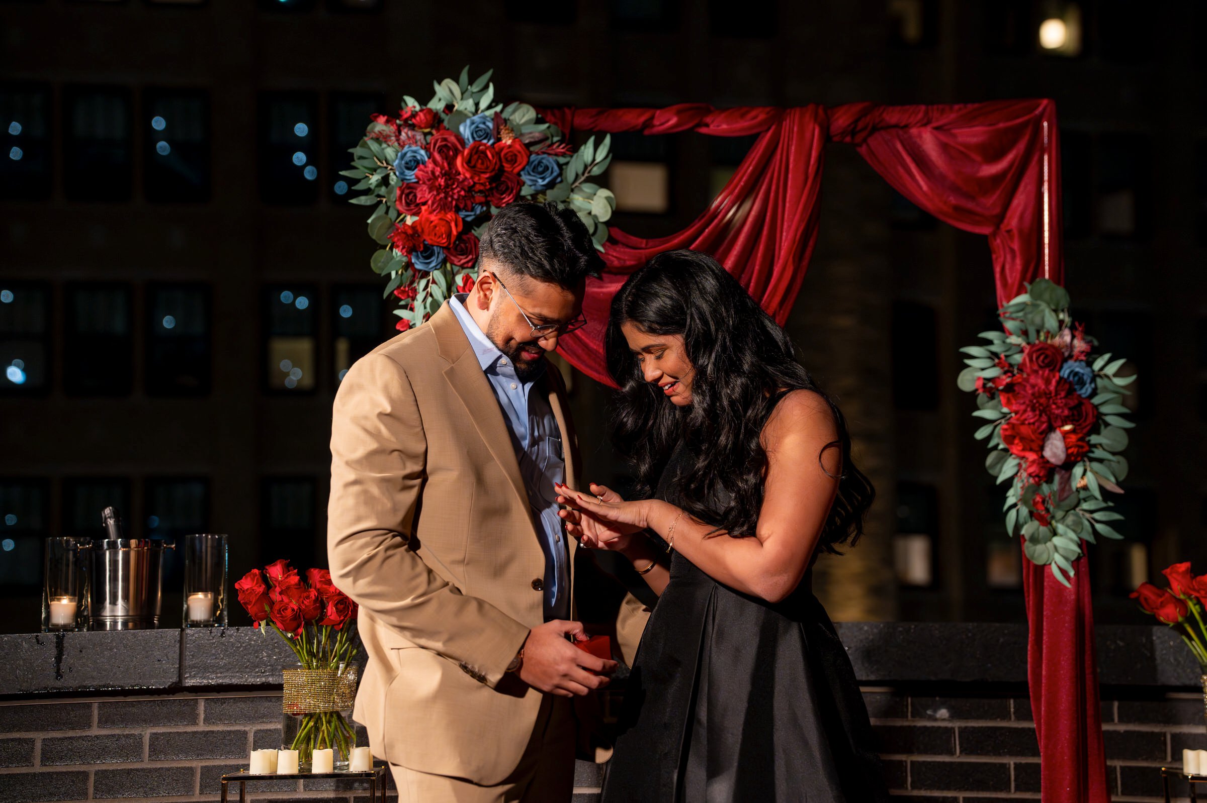 A fiancee looks at her new engagement ring following her Shinola Hotel proposal.