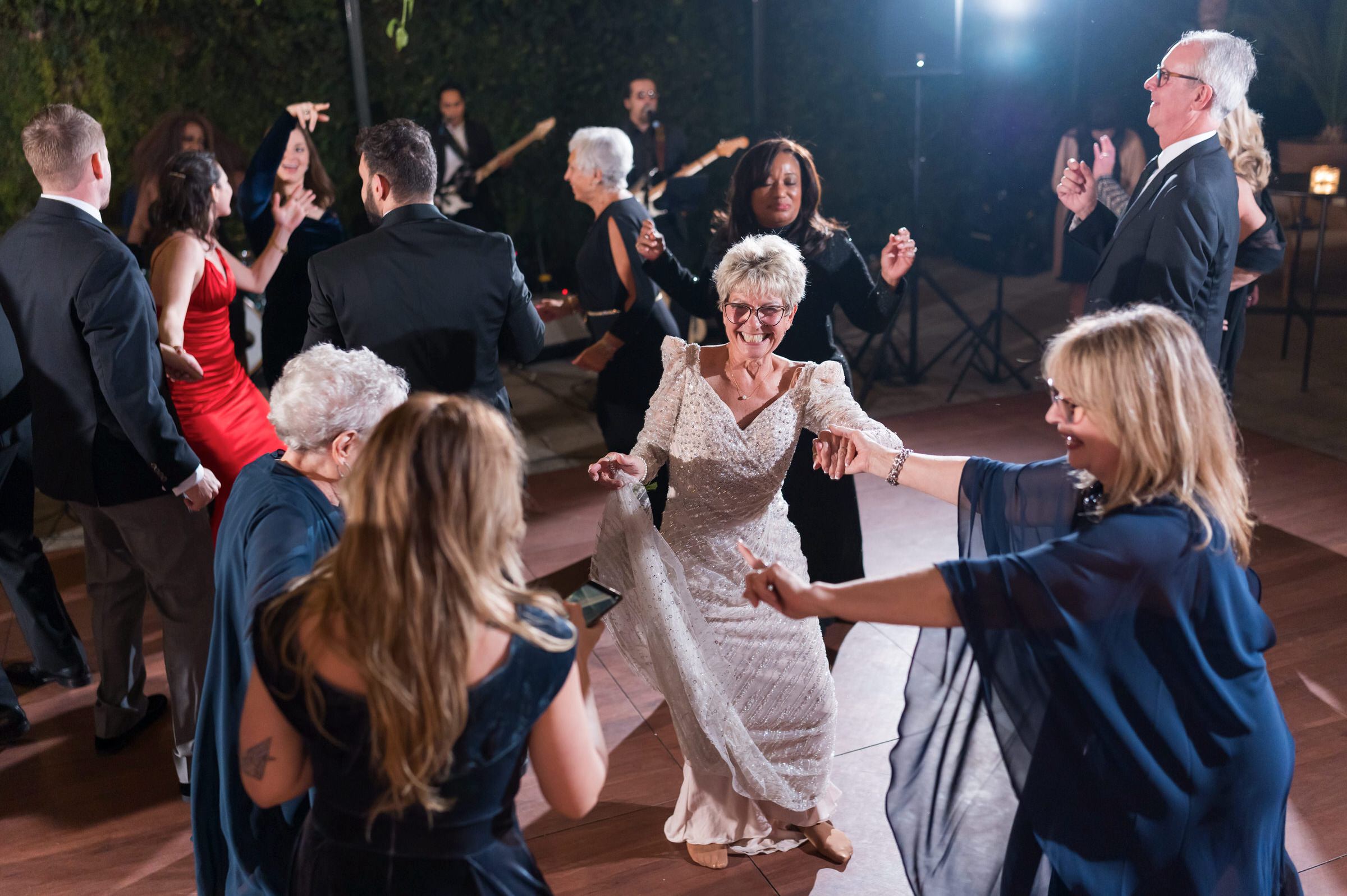 Guests dance on the dancefloor at a Planterra wedding. 