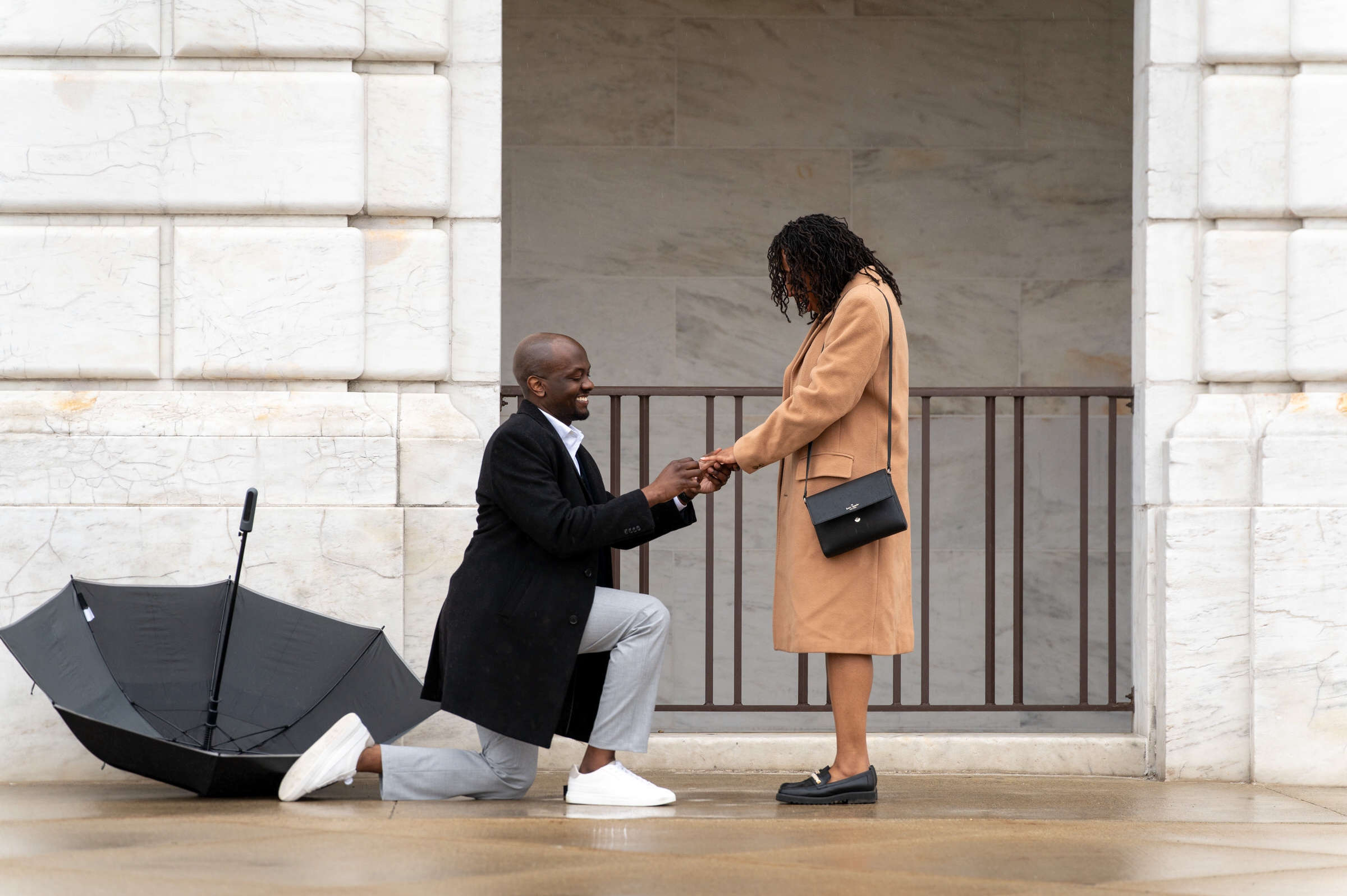 A gentleman takes a knee during a marriage proposal at the DIA.