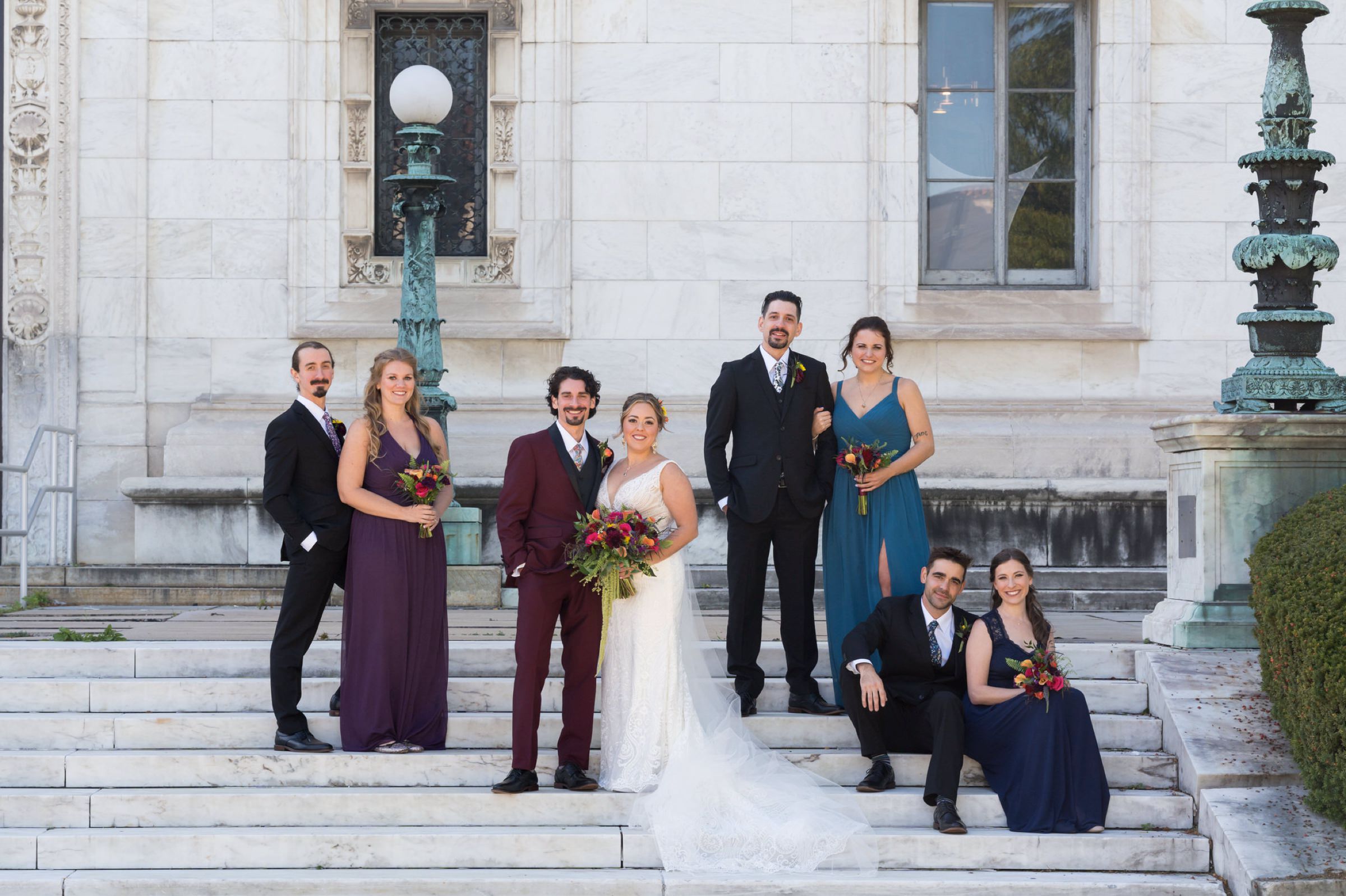 A bridal party poses on the steps of the Detroit Public Library on Woodward. 