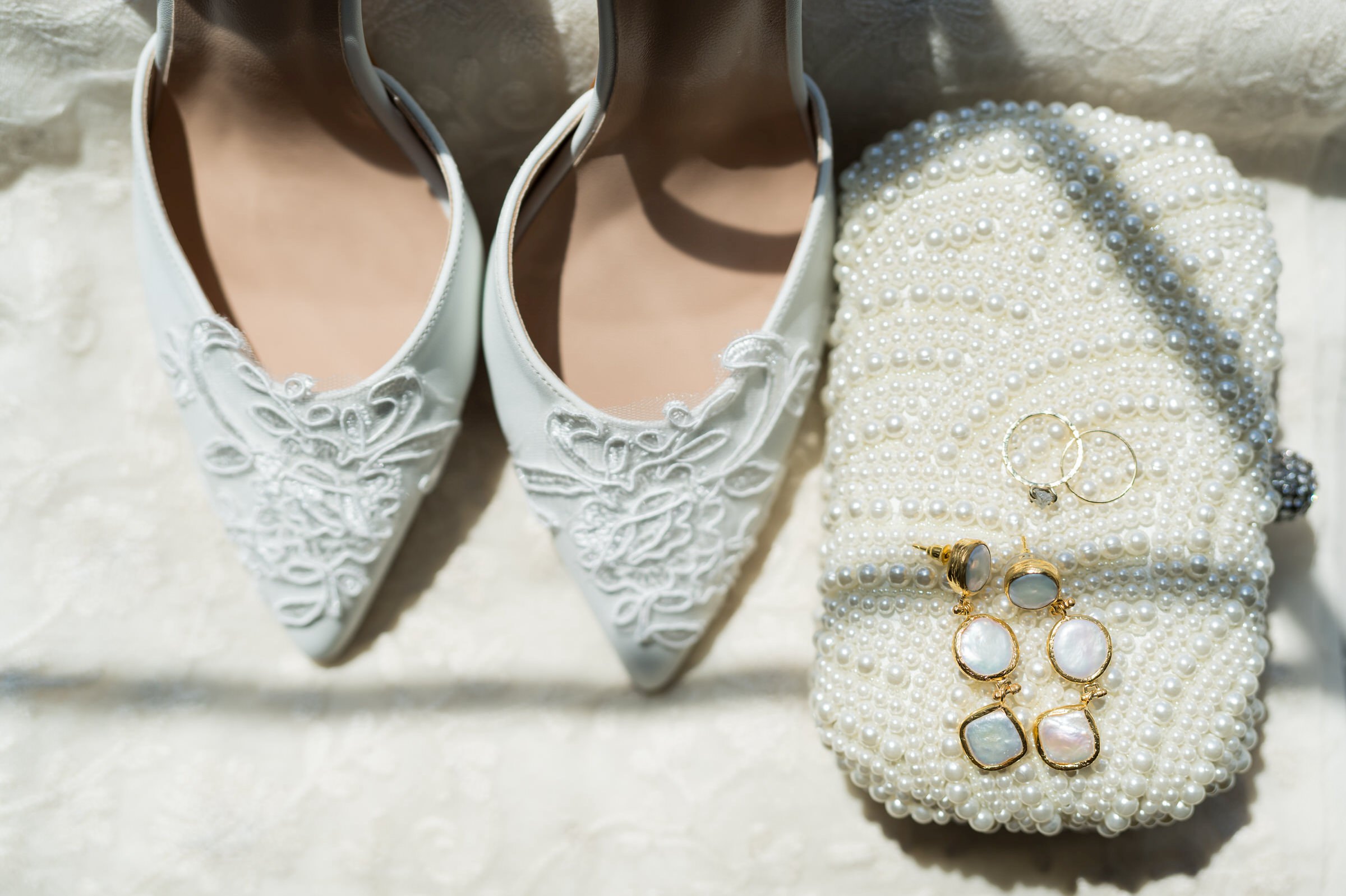 Bride's shoes, earrings and wedding ring at Traverse City wedding.  