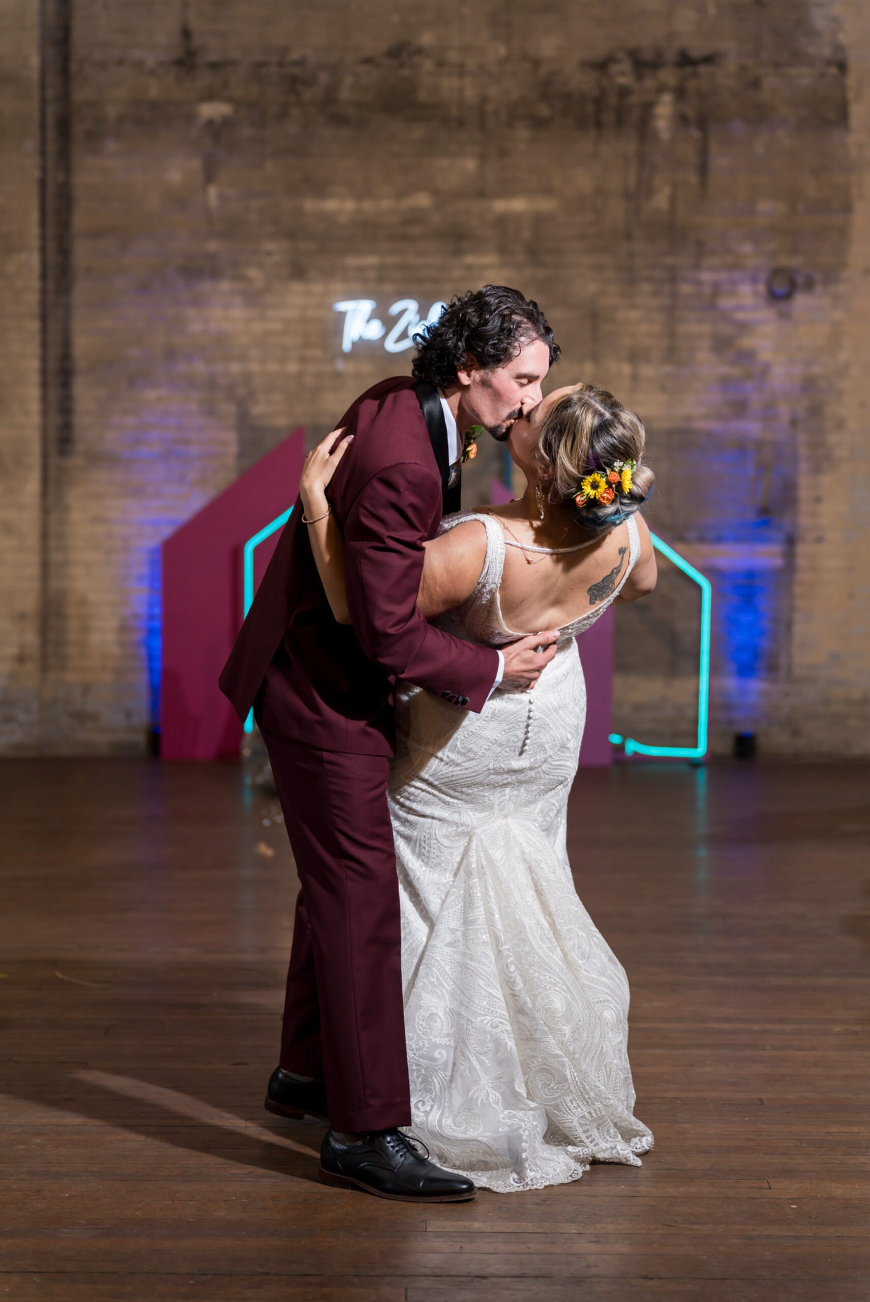 A bride and groom kiss during their first dance at their Jam Handy wedding.  