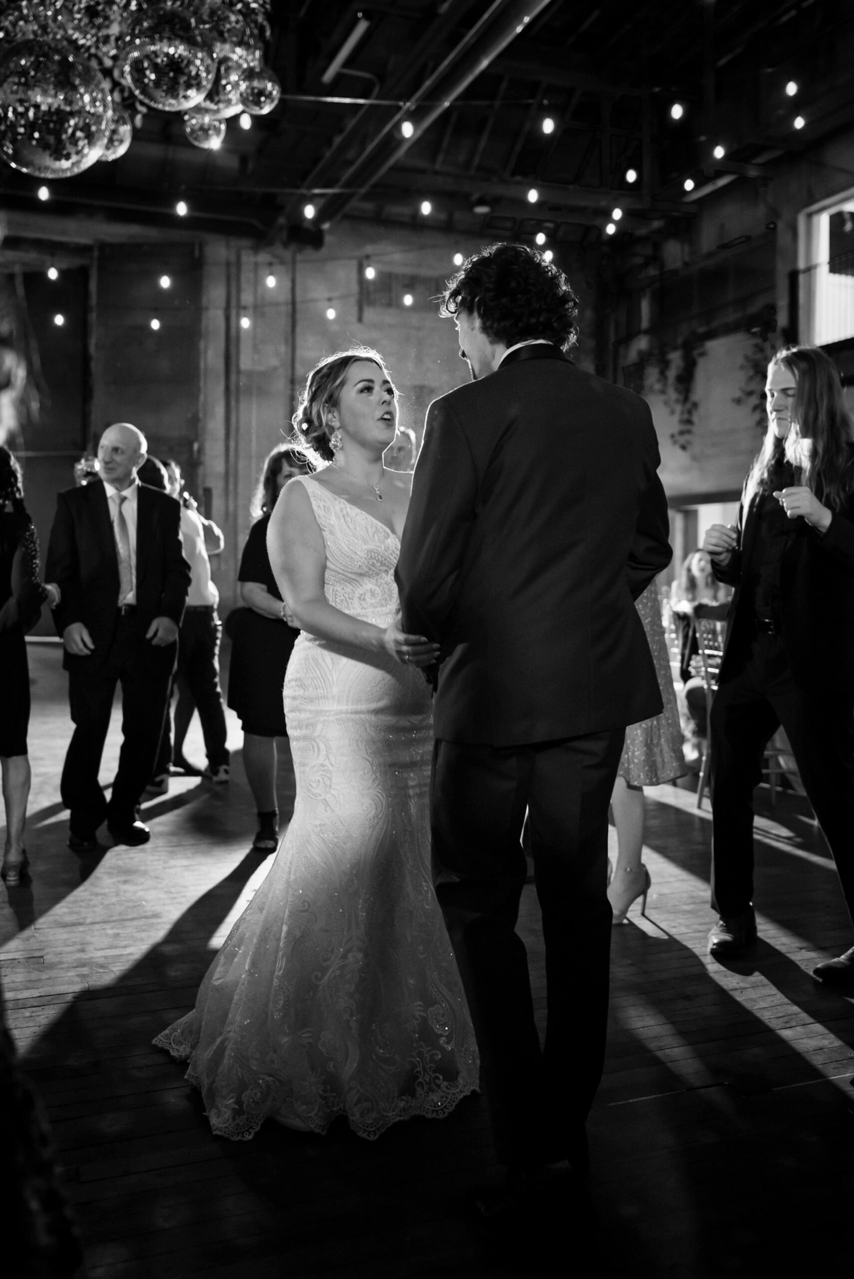 A bride and groom dance on their open dance floor during their Jam Handy wedding.  