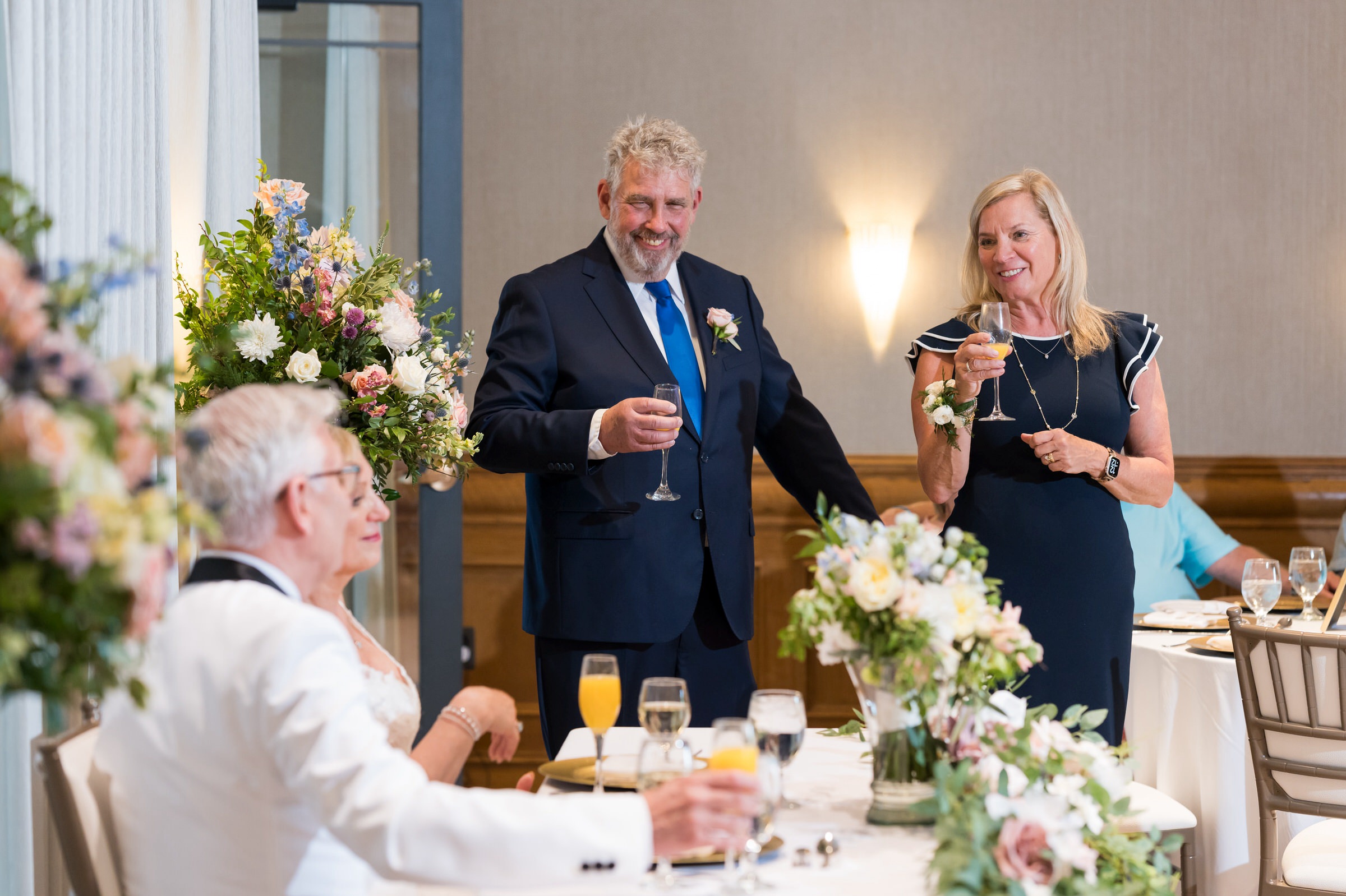 Guests toast the bride and groom at a private wedding at St. John's Resort.