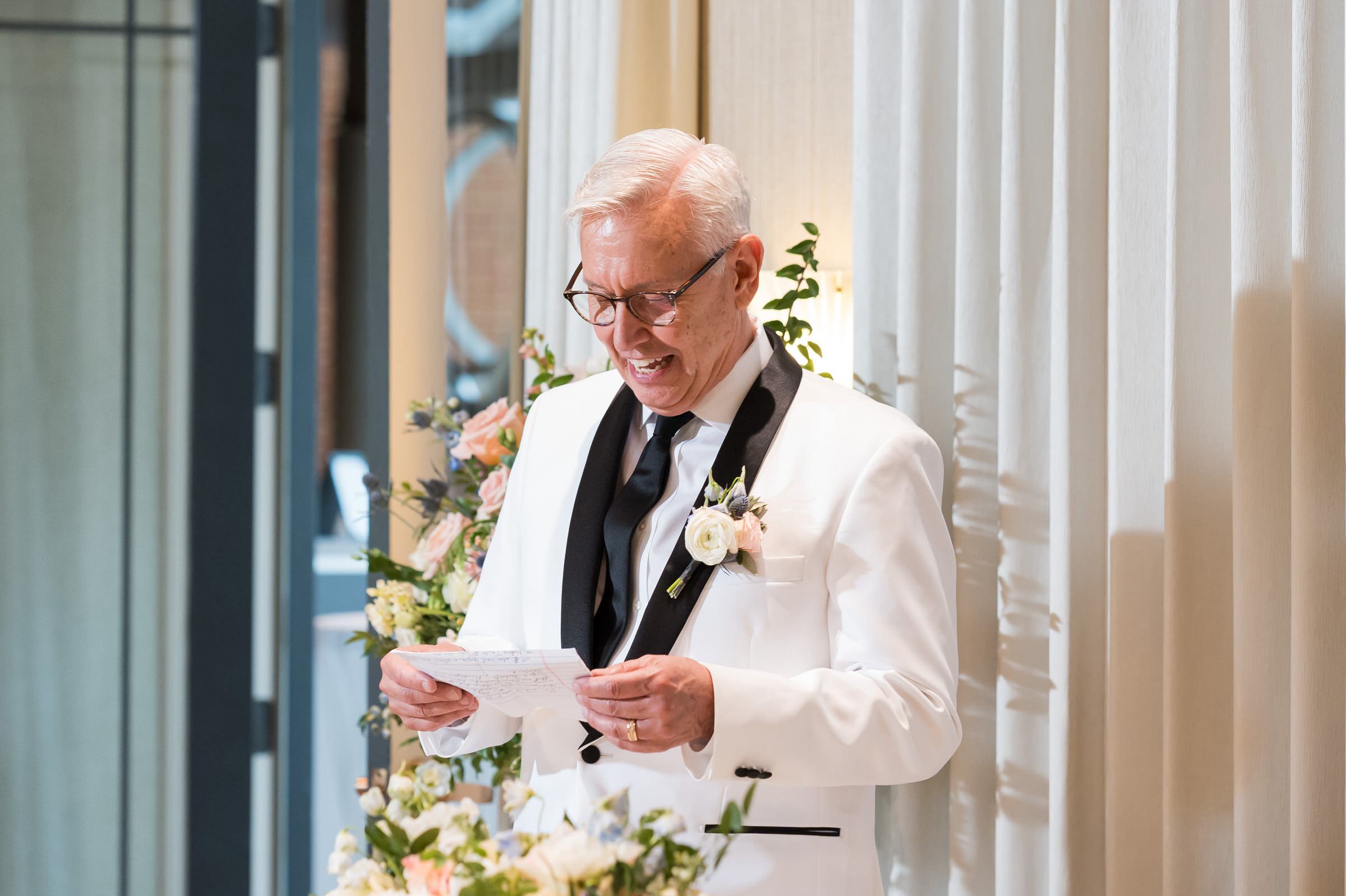 A groom reads a speech at his private wedding at St. John's Resort.