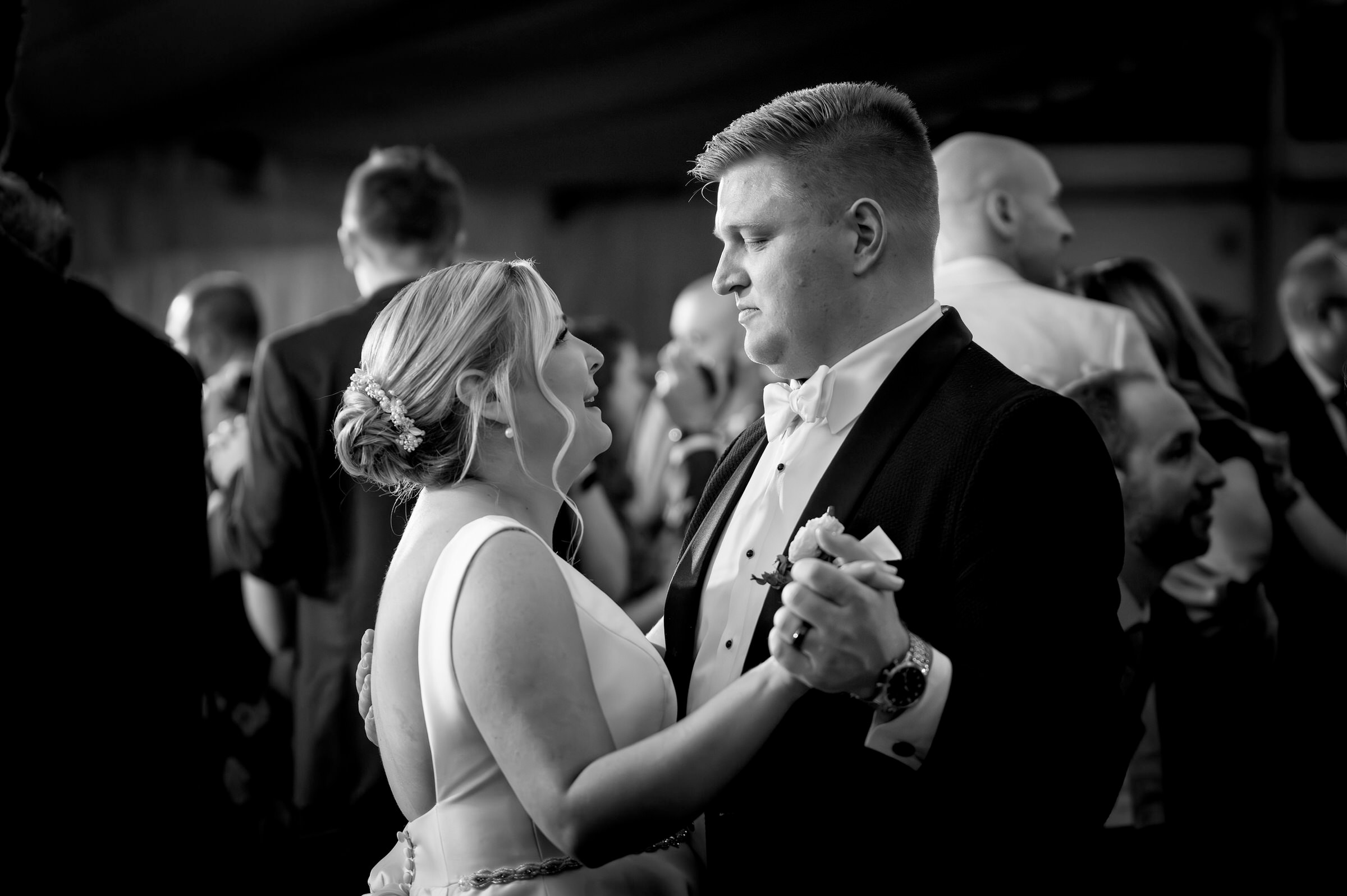 Close up of bride and groom on dance floor during wedding 