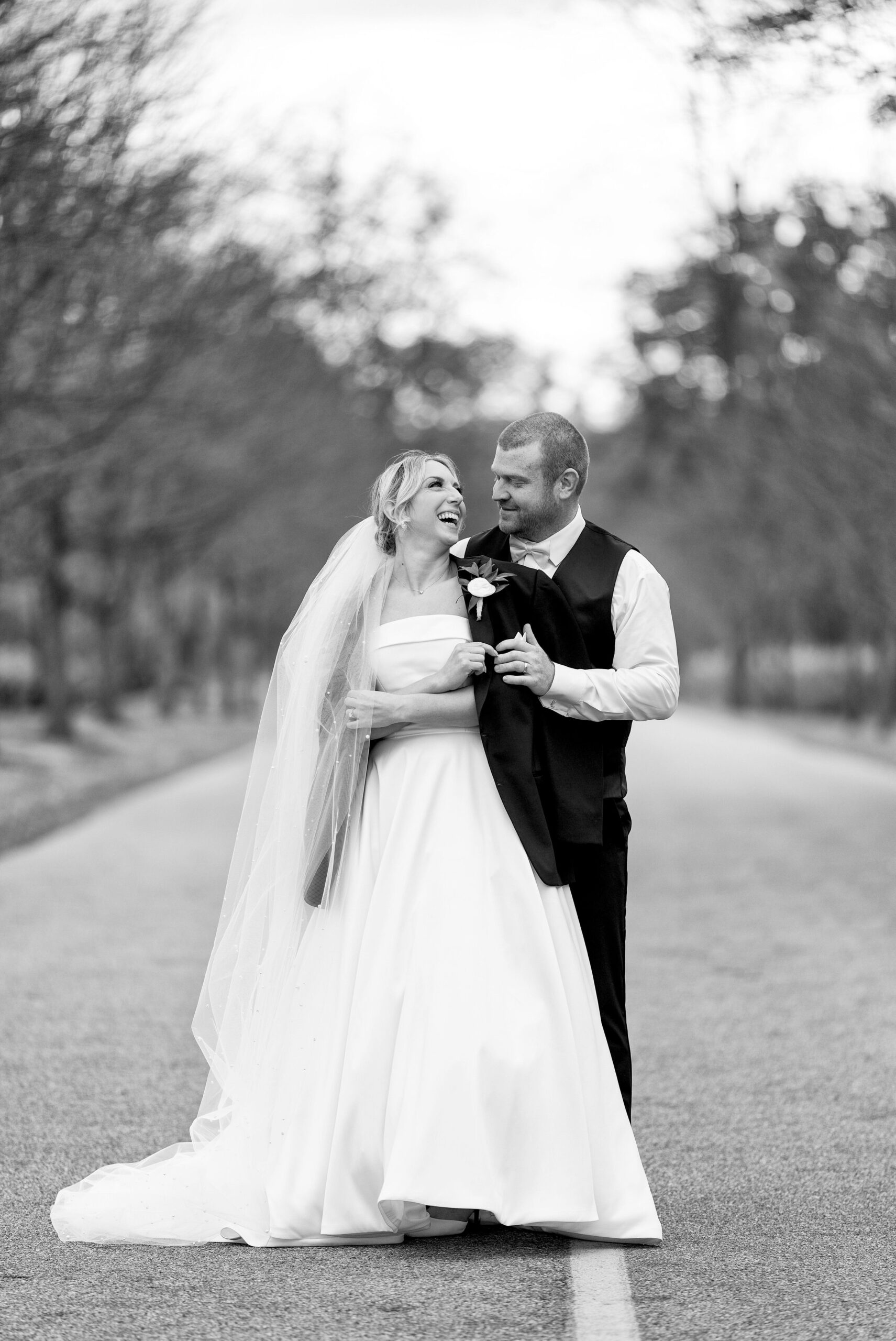 Justin offers Rachel his jacket during Addison Oaks Wedding 