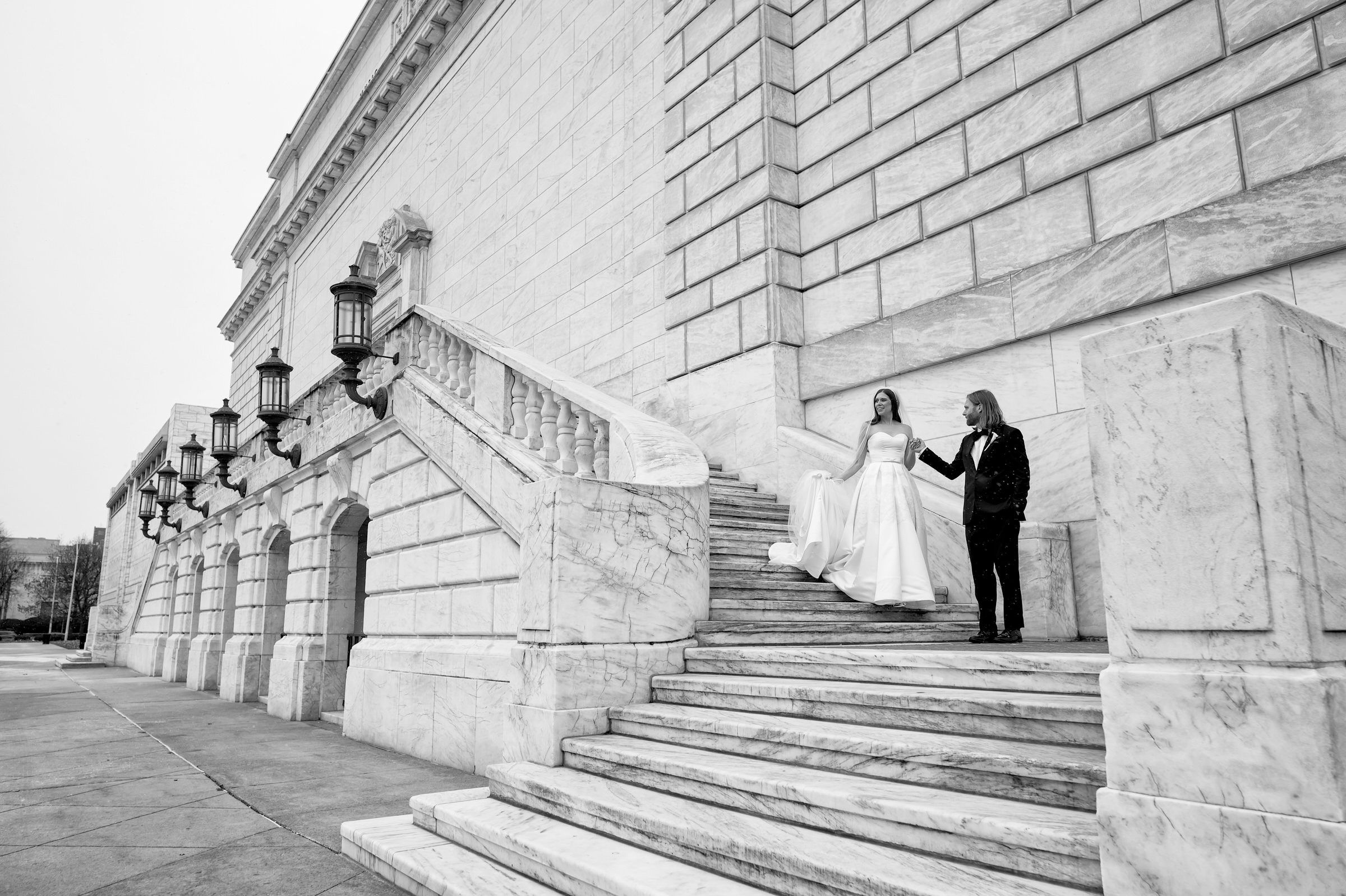 Bride and groom walk down stairs prior to St. Michaels Episcopal wedding